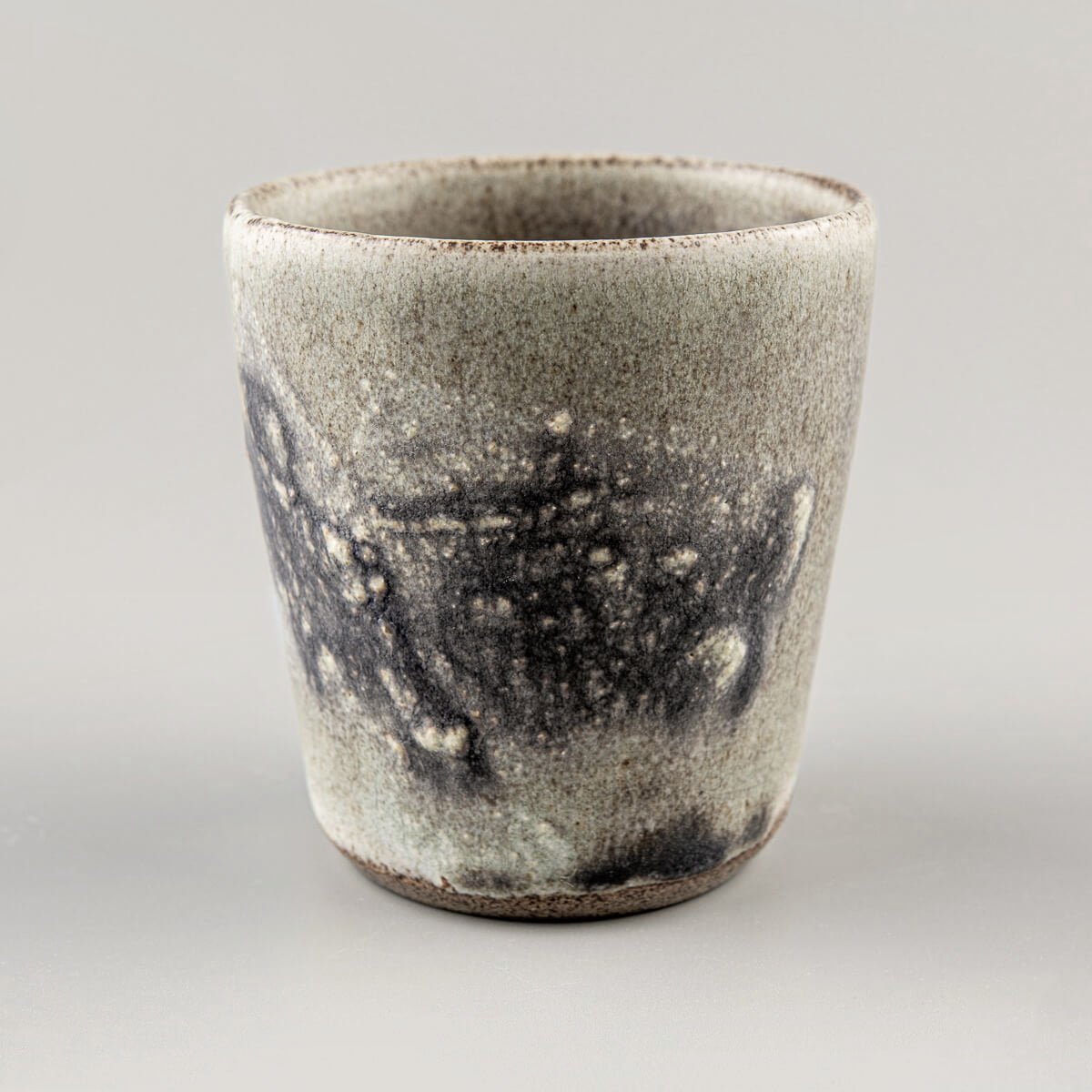 Interior view of pottery cup with unique glaze finish, crafted for culinary presentation and matcha tea rituals.