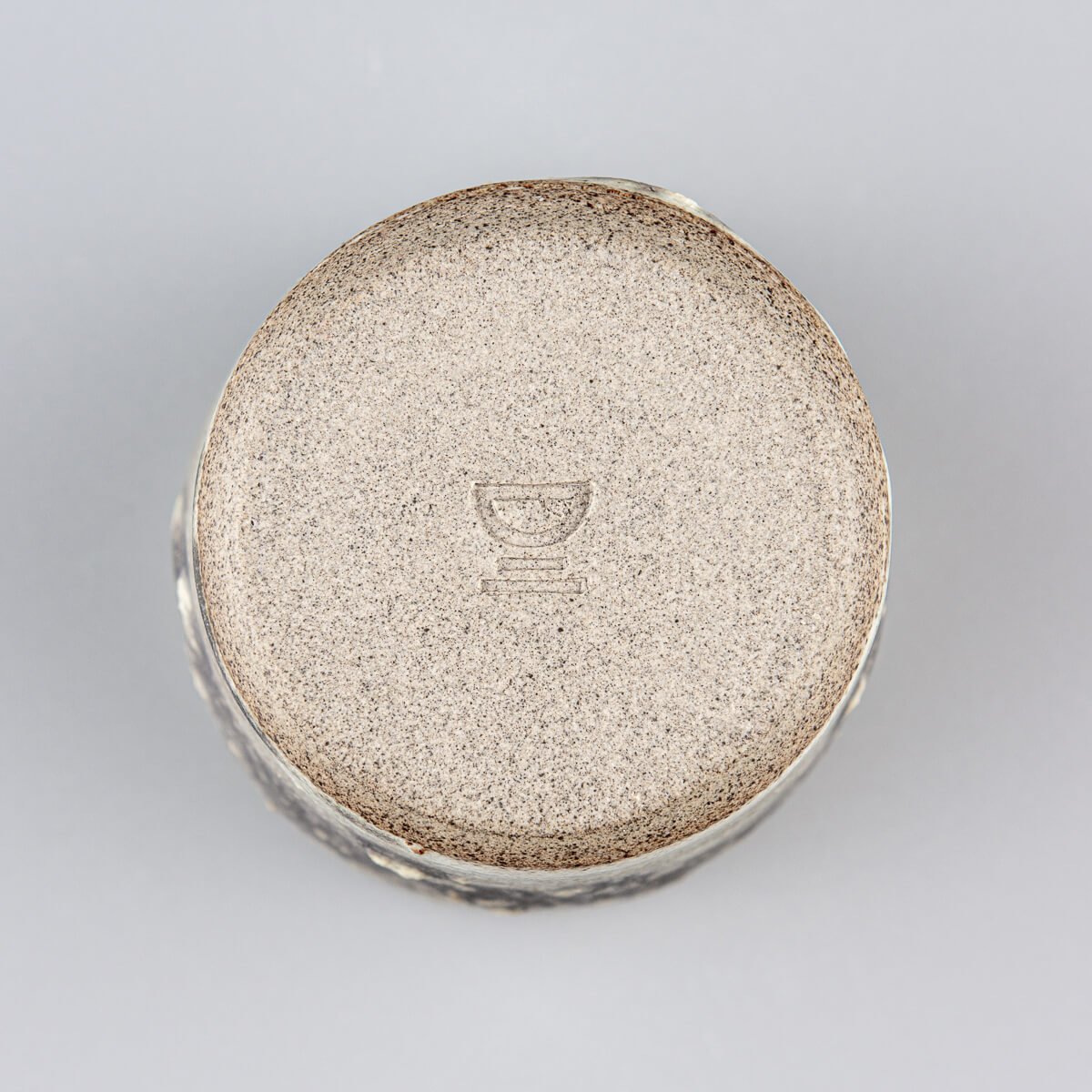 This handmade pottery cup showcases delicate craftsmanship and durable stoneware for everyday use.