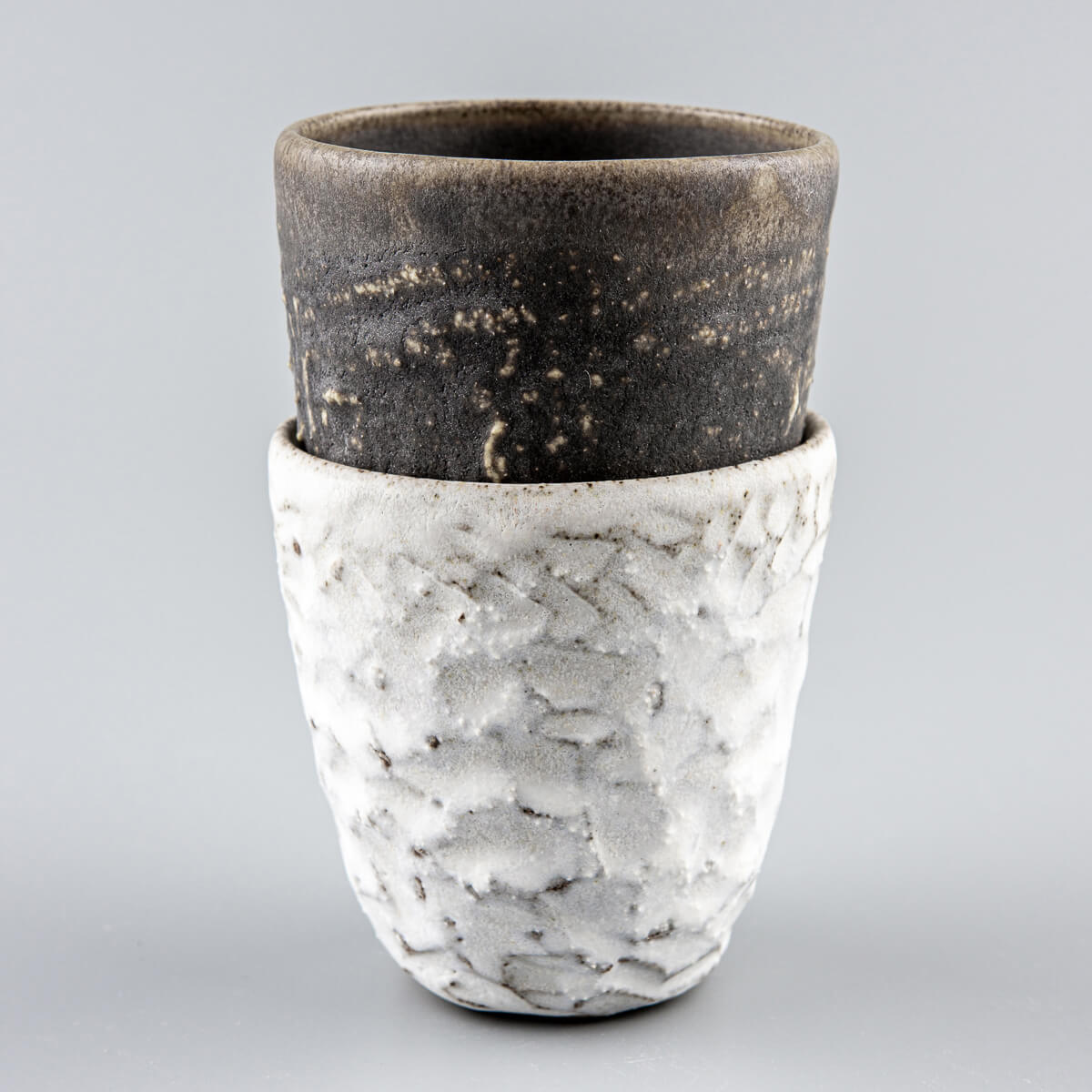 Elegant handmade ceramic mugs set with unique textures, ideal as a wedding gift, housewarming gift, or collector’s piece.