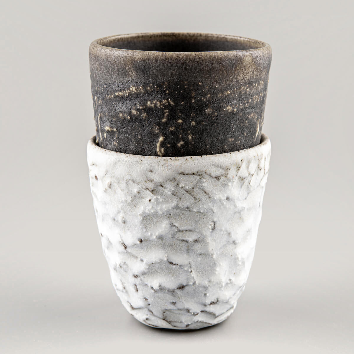 Elegant handmade ceramic mugs set with unique textures, ideal as a wedding gift, housewarming gift, or collector’s piece.