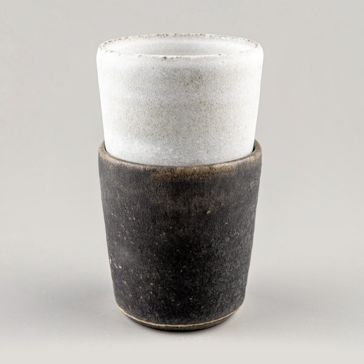 Rustic ceramic cup with dark olive glaze, perfect for restaurants, home decor, and kitchenware.
