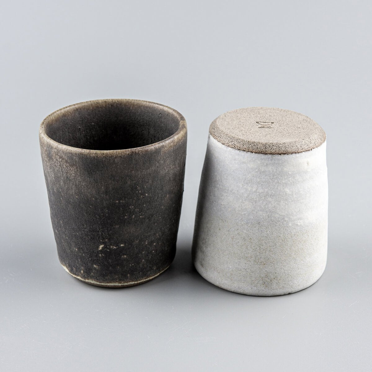 Luxury pottery cups crafted from stoneware, blending modern minimalism with timeless craftsmanship.