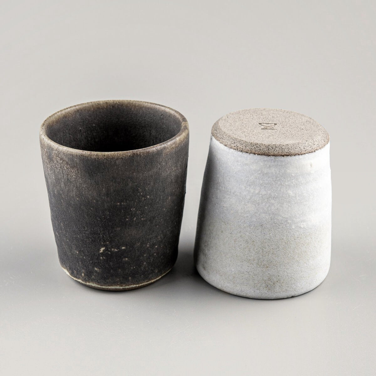 Luxury pottery cups crafted from stoneware, blending modern minimalism with timeless craftsmanship.