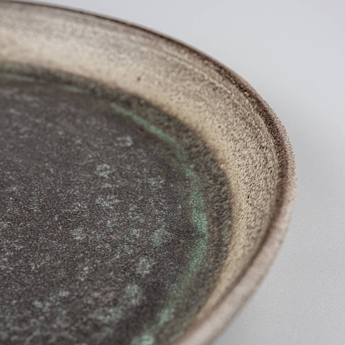 Fine dining presentation plate with subtle glaze transitions.