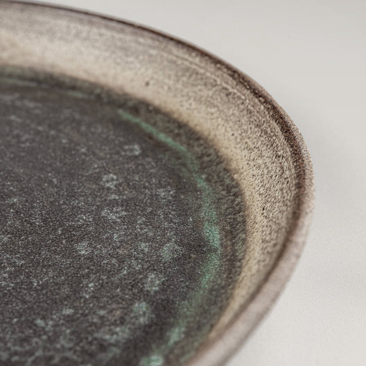 Fine dining presentation plate with subtle glaze transitions.
