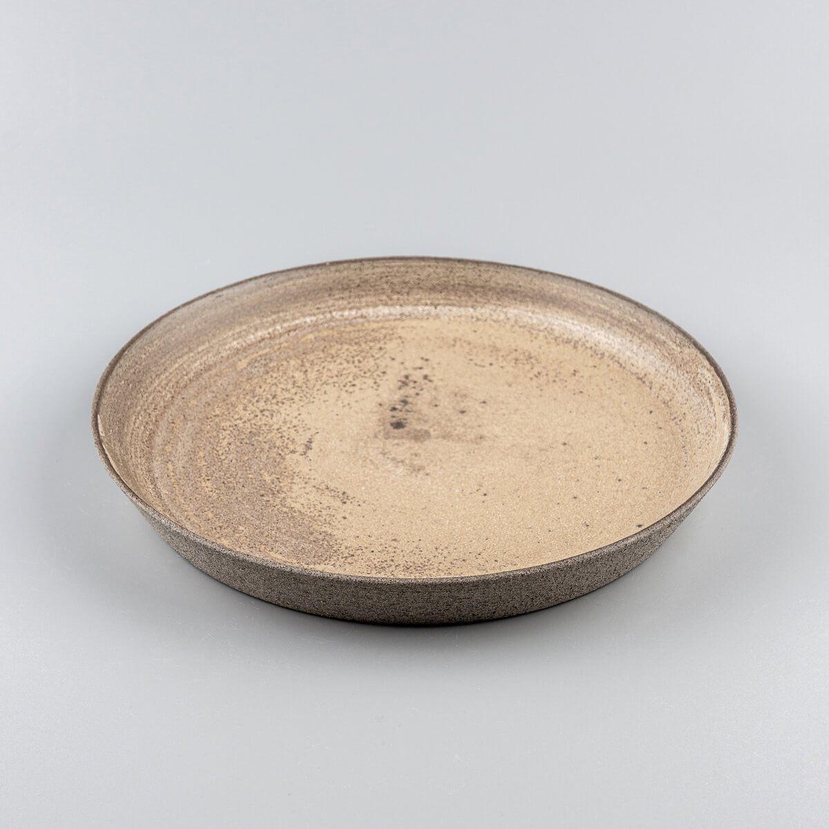 Premium stoneware dinner plate with earthy matte glaze and artisanal finish.
