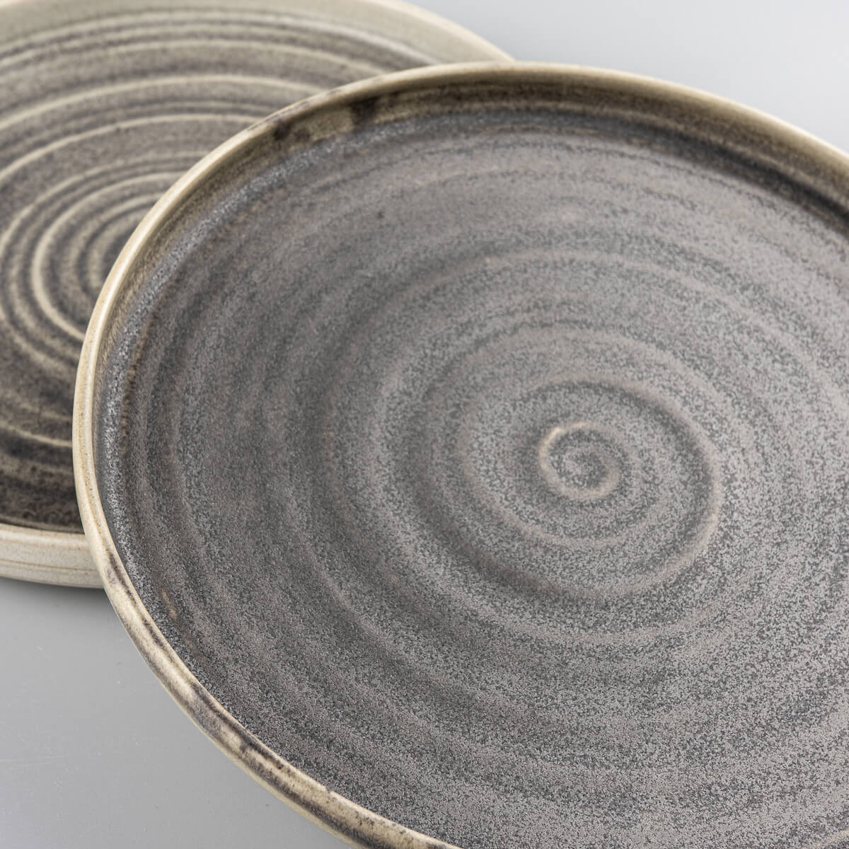 Fine dining ceramic plate set with spiral texture and olive green matte finish.