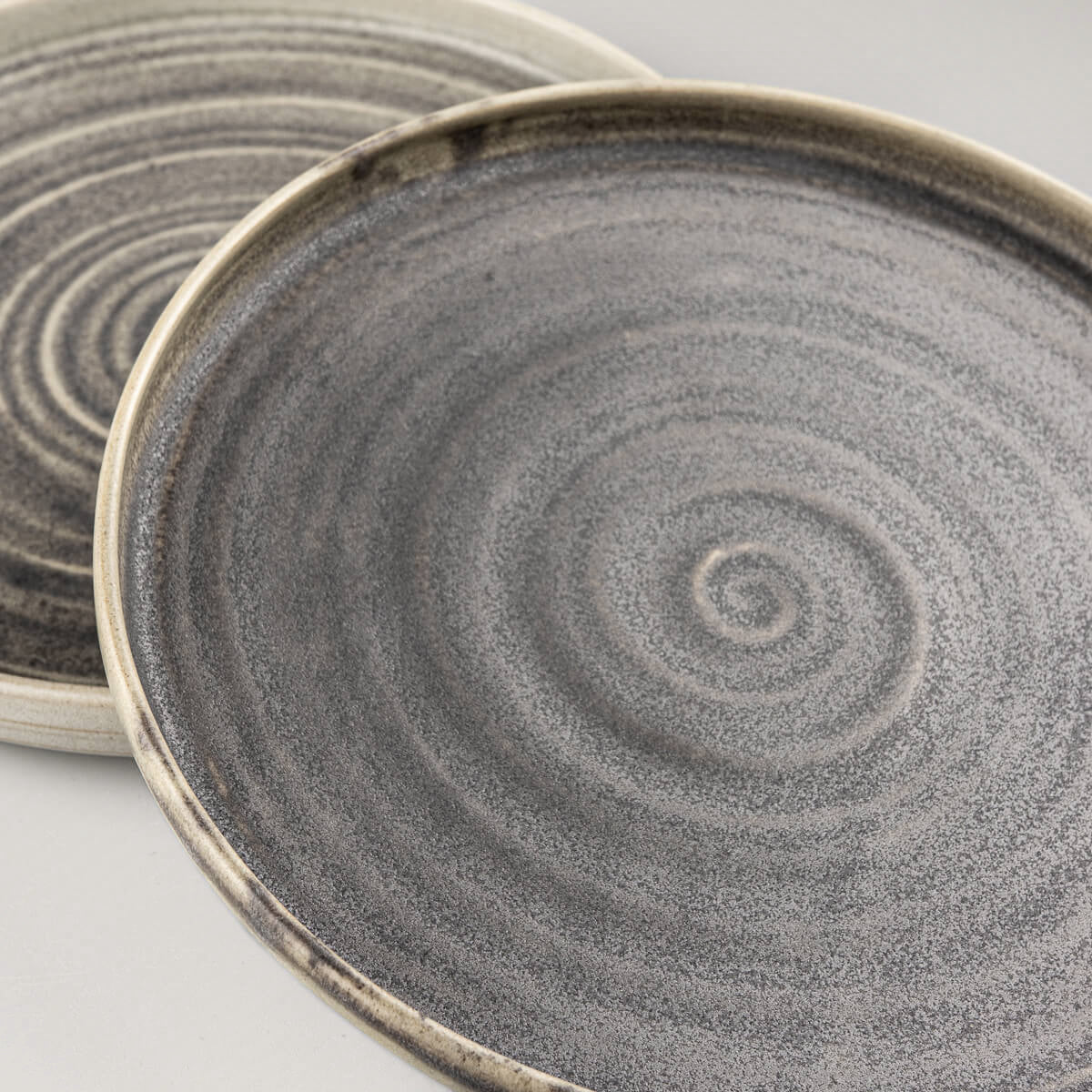 Fine dining ceramic plate set with spiral texture and olive green matte finish.