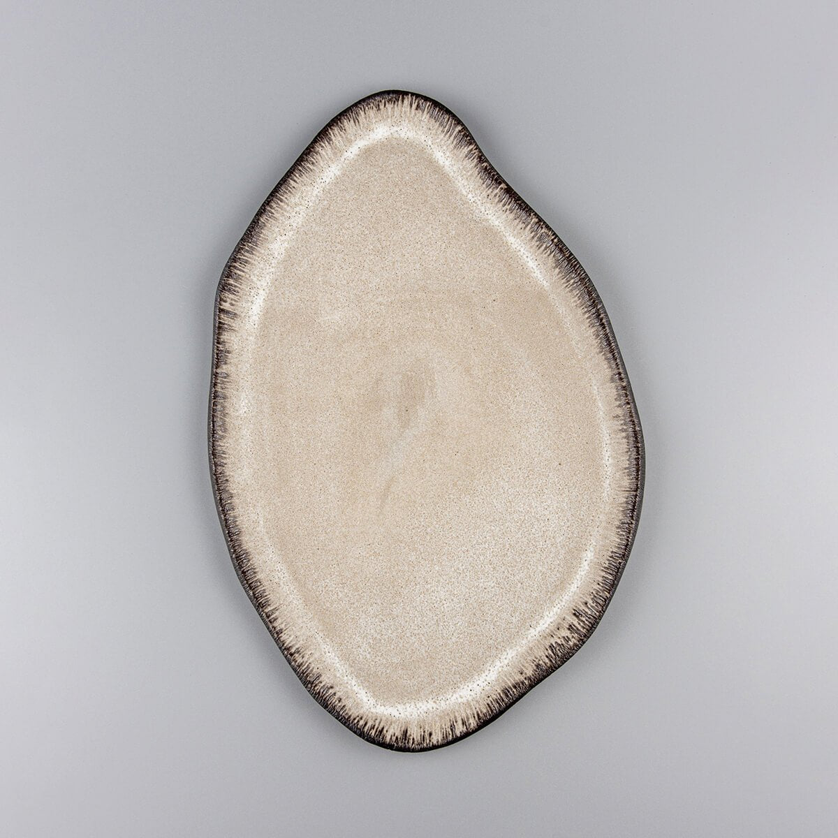 Elegant custom ceramic plate with matte white glaze, ideal for fine dining presentation in luxury restaurants.