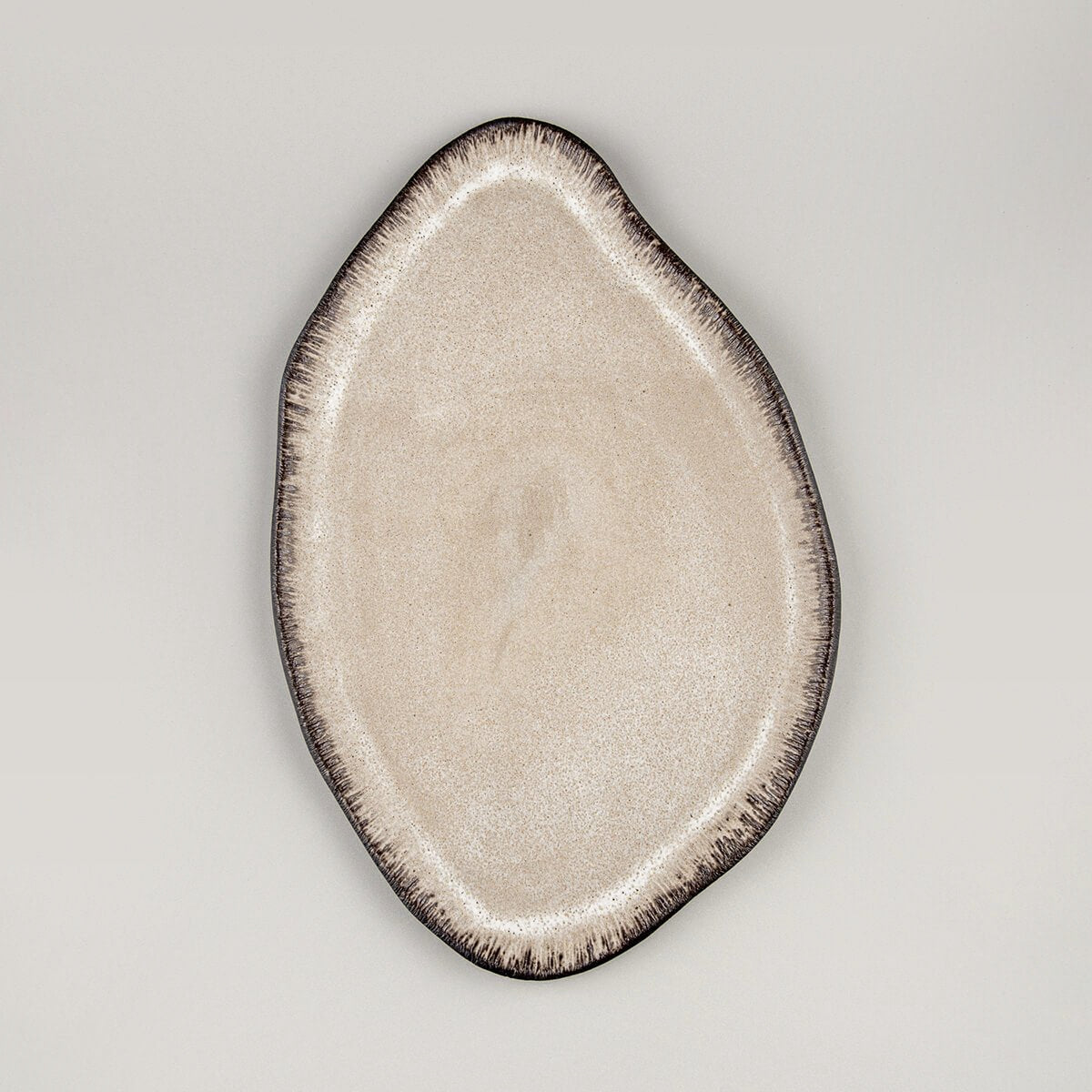 Elegant custom ceramic plate with matte white glaze, ideal for fine dining presentation in luxury restaurants.