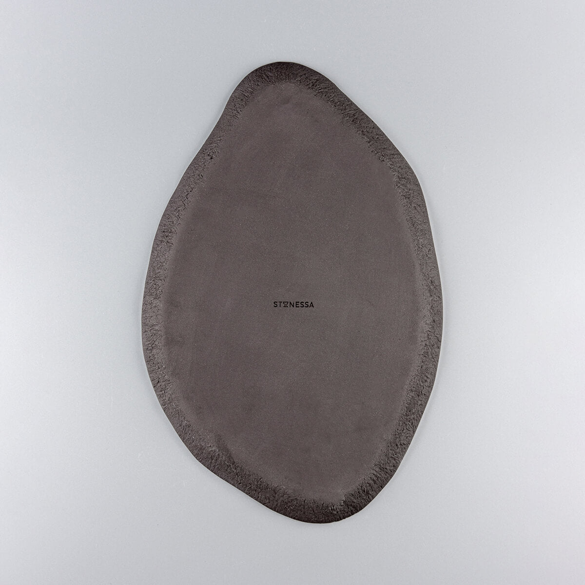 Back view of unglazed black stoneware clay showcasing artisanal craftsmanship.