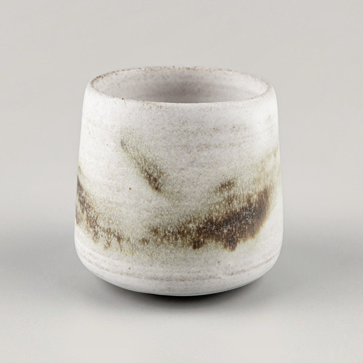 Artisan espresso cup with beveled bottom, luxury tableware for restaurants, hotels, and interior design collectors.