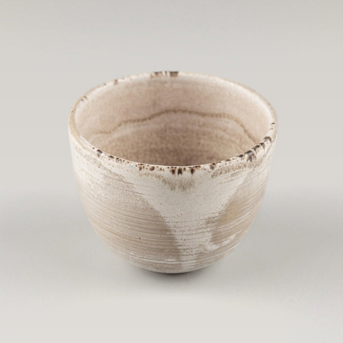 Top view of a handmade stoneware coffee cup with a minimalist design for home and restaurant use.