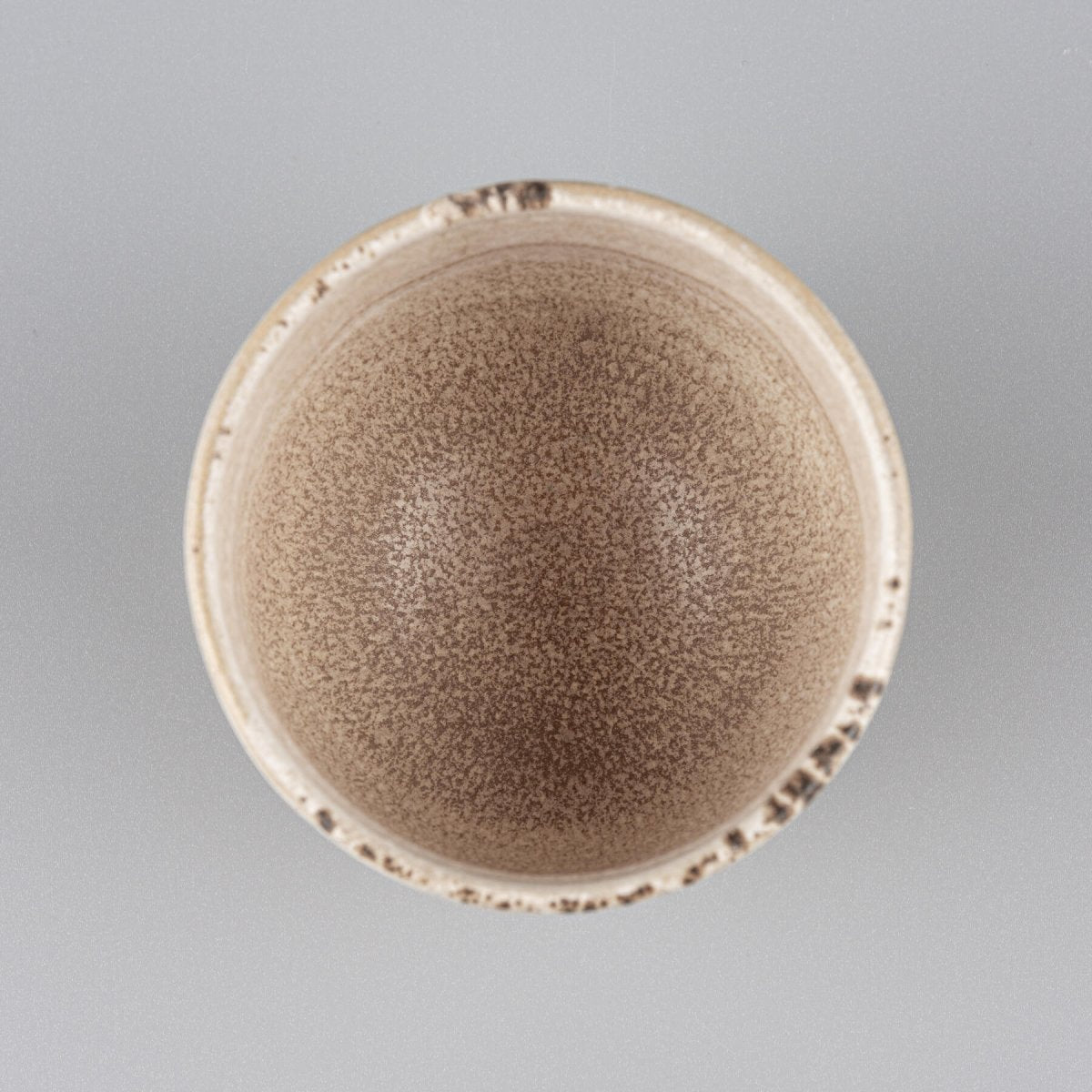 Top view of handmade stoneware coffee cup with matte glaze interior, perfect for restaurant and fine dining presentation.