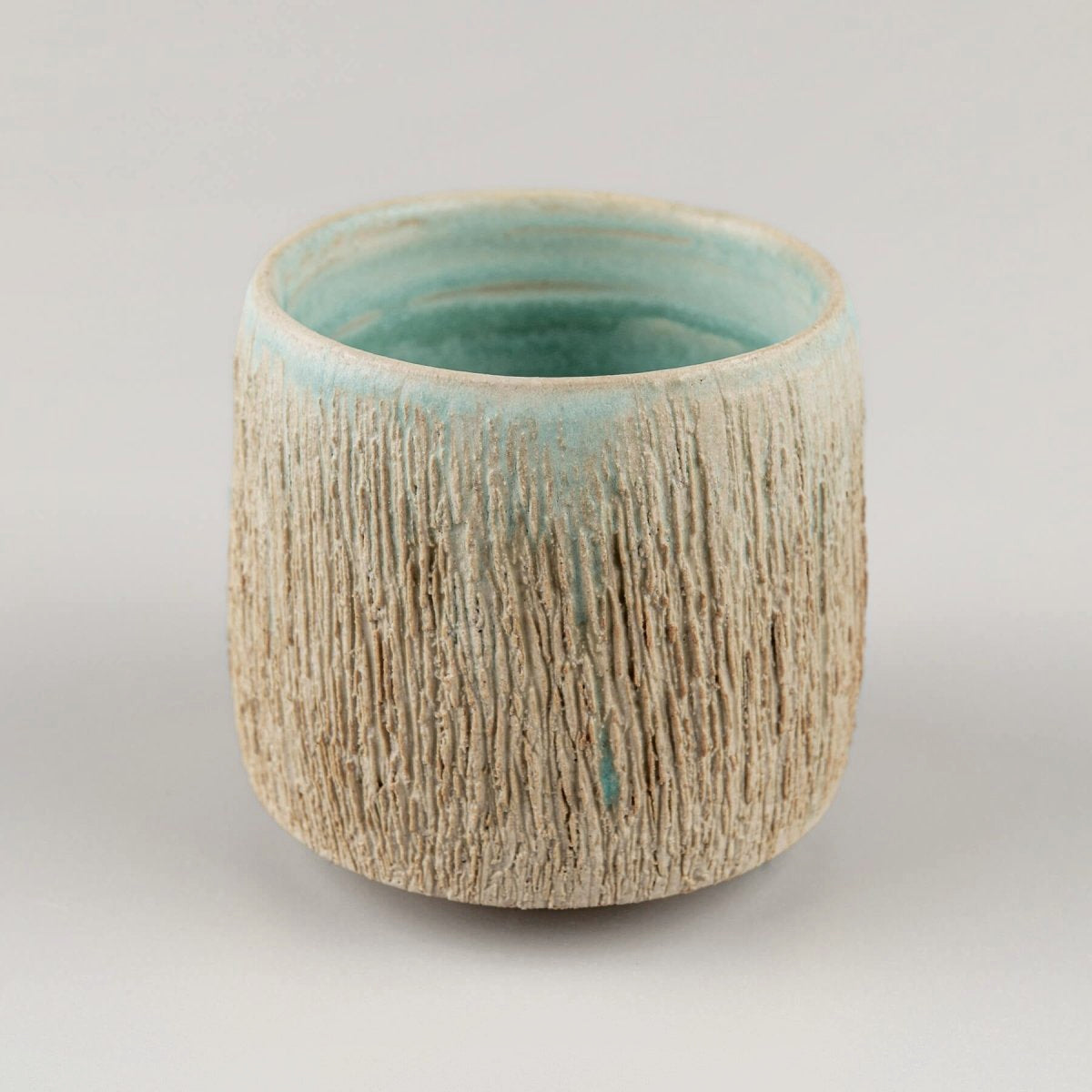 Stoneware pottery mugs with turquoise glaze inside, perfect for coffee, tea, or matcha rituals.