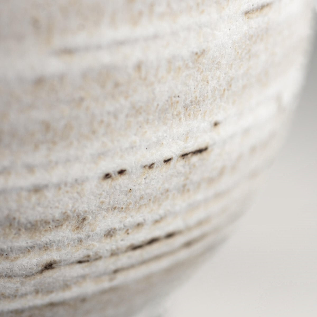 Designer handmade coffee mug with a rustic yet modern look, created as a collectible pottery piece.