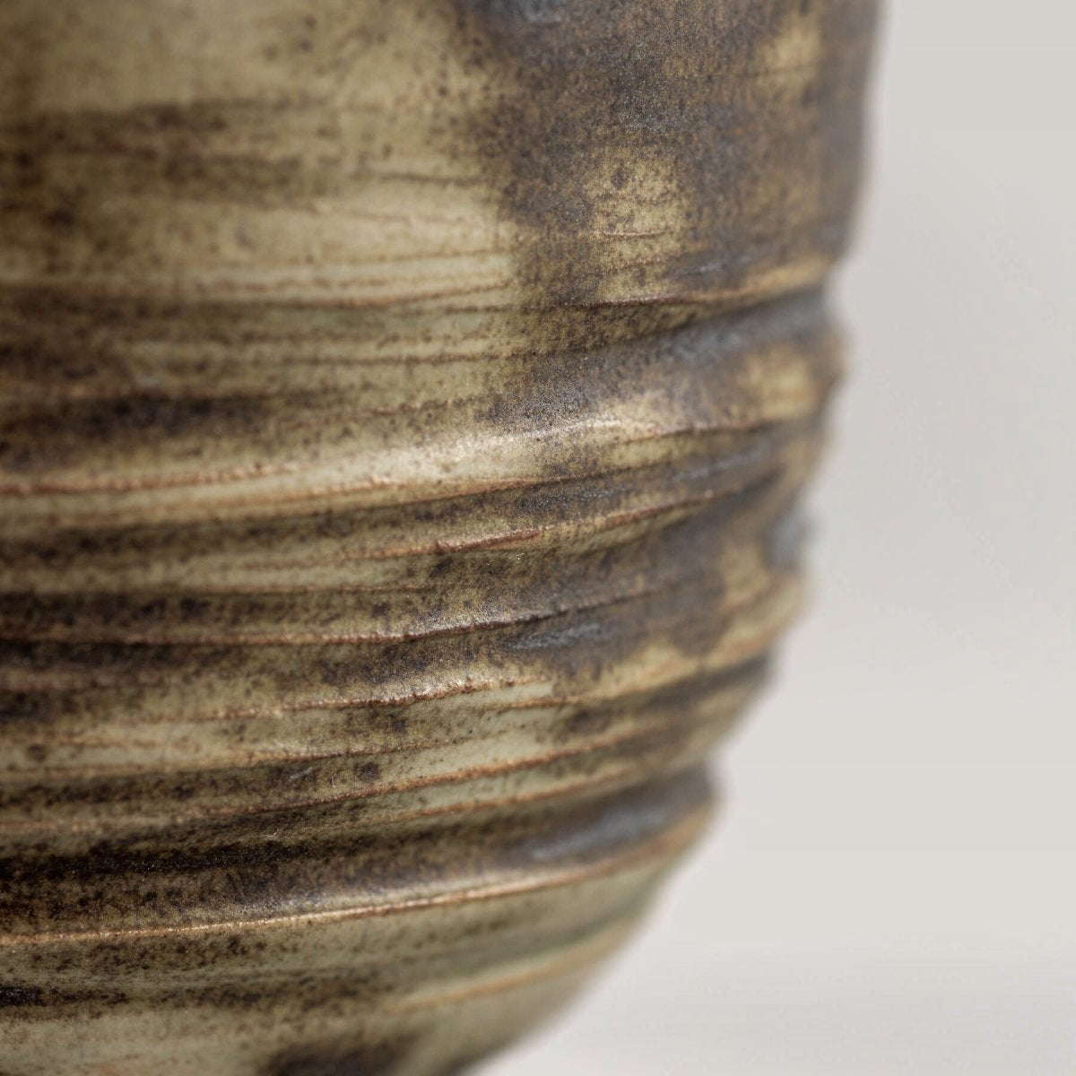 Luxury ceramic mug detail with natural stoneware texture and glaze variations, ideal for restaurants and interior design.