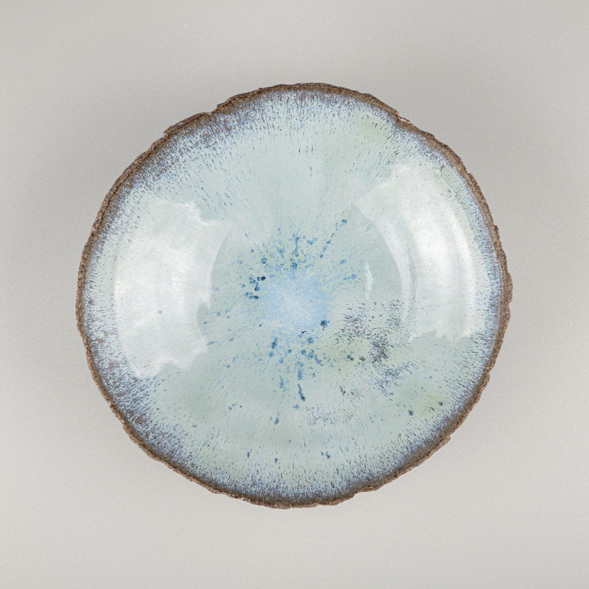 Top view of artisan ceramic bowl showing ocean-inspired blue glaze.