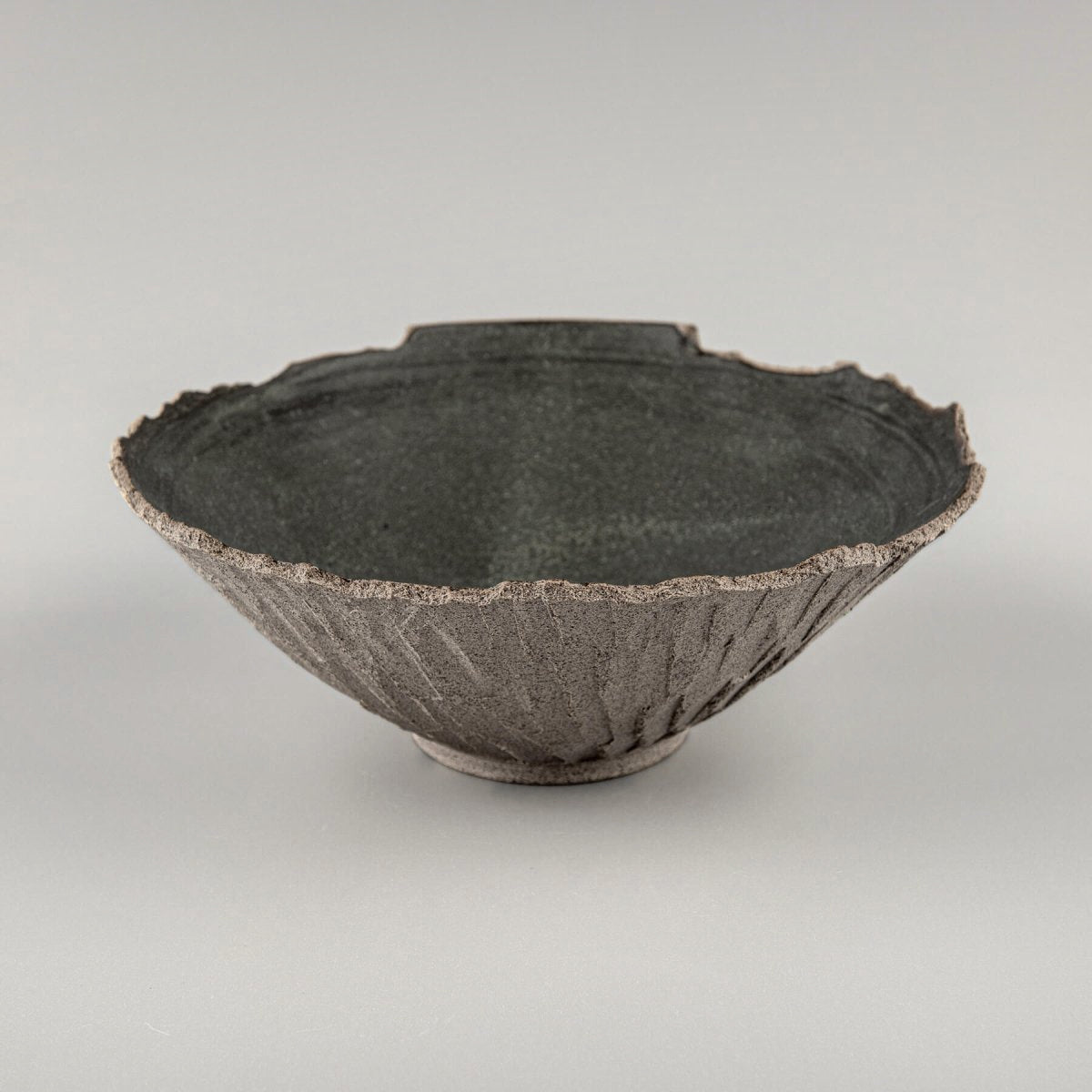 Interior detail of matte black glazed ceramic bowl, made for culinary presentation and decor.
