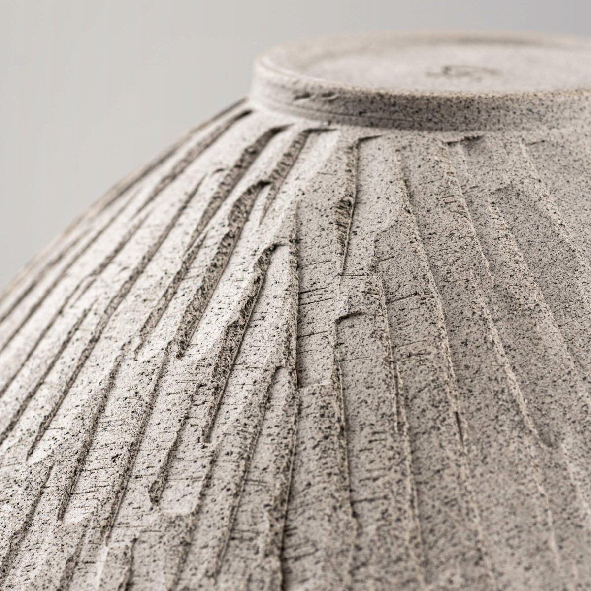 Underside texture of ceramic bowl with visible turning marks, great for display or functional kitchenware.