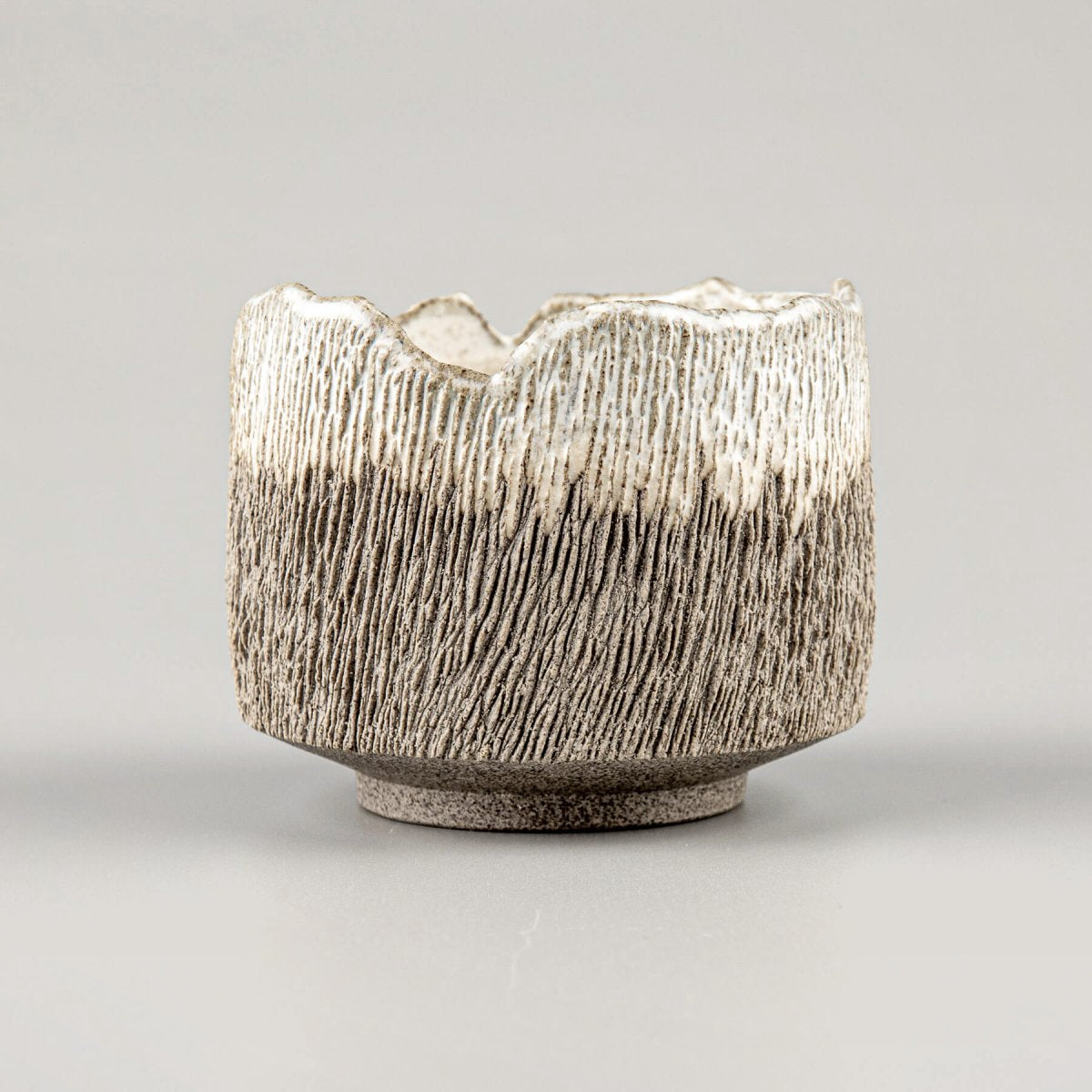 Handcrafted coffee cups, stoneware with carved texture and semi-gloss glaze for home and fine dining.