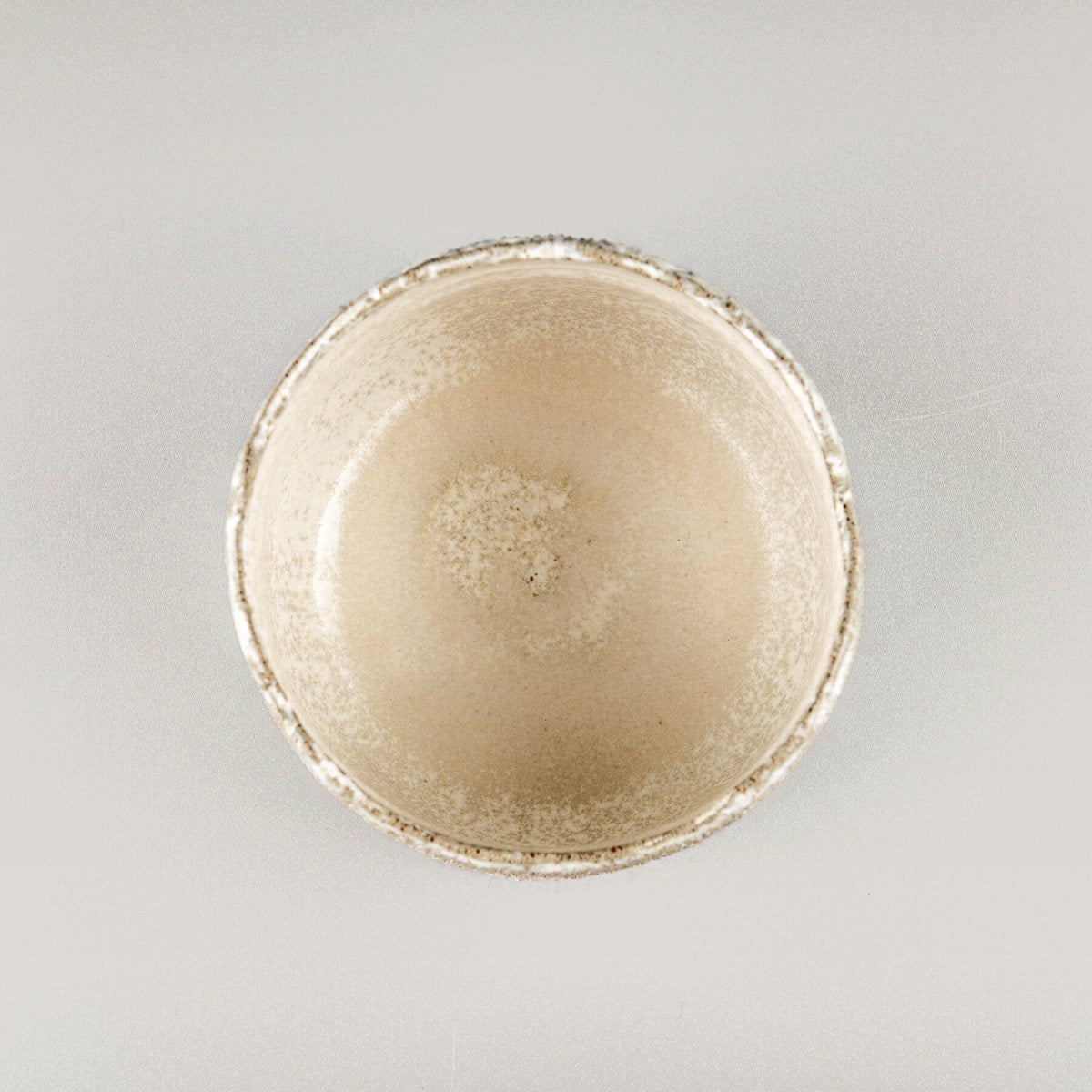 Interior view of handmade stoneware coffee cups with semi-gloss white glaze.
