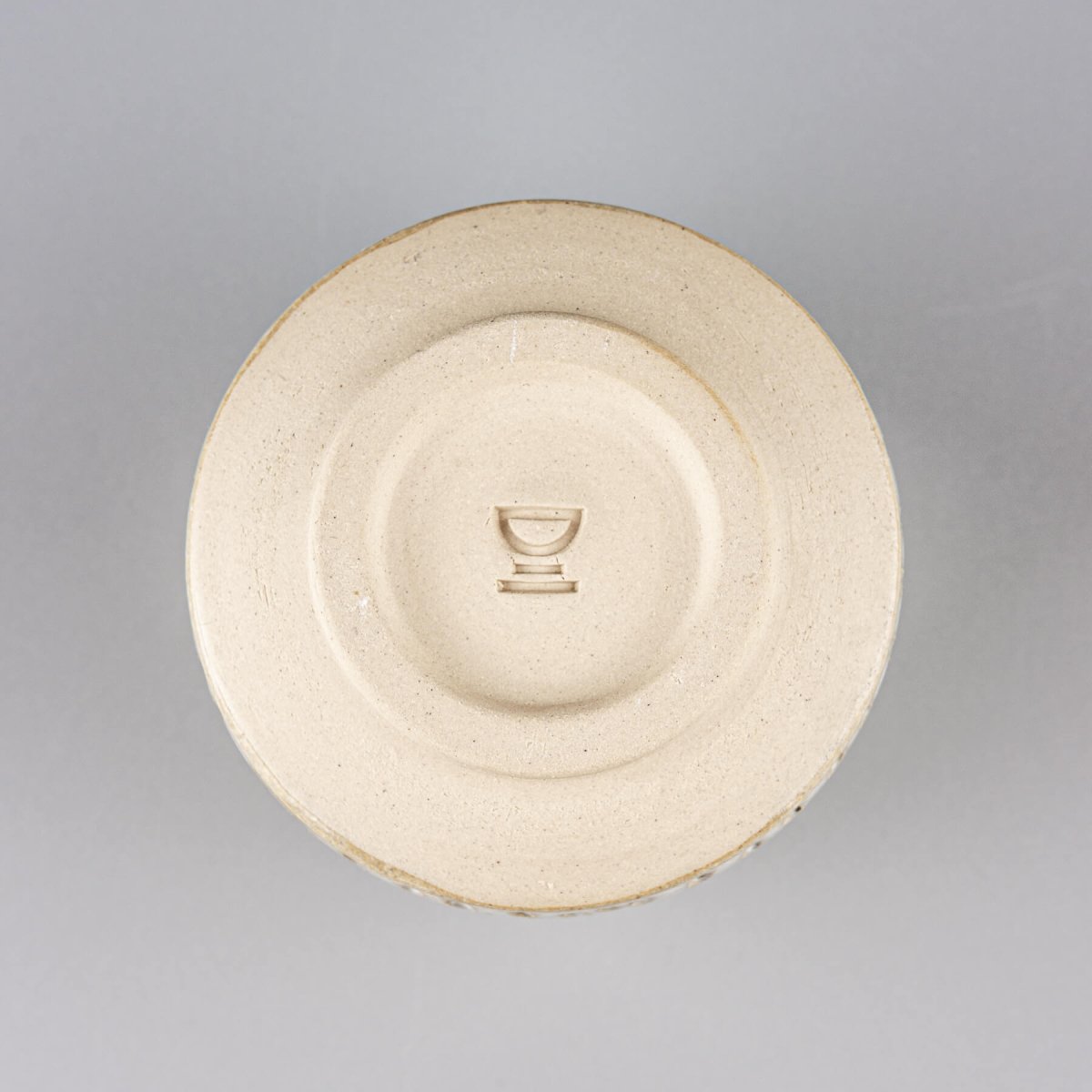 Base of handmade ceramic espresso cup showcasing authentic pottery craftsmanship and timeless design.
