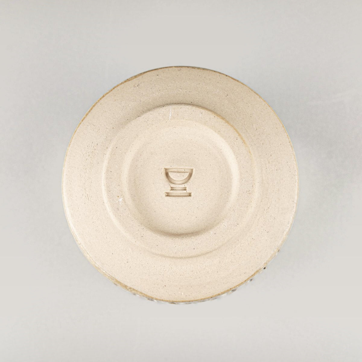 Base of handmade ceramic espresso cup showcasing authentic pottery craftsmanship and timeless design.