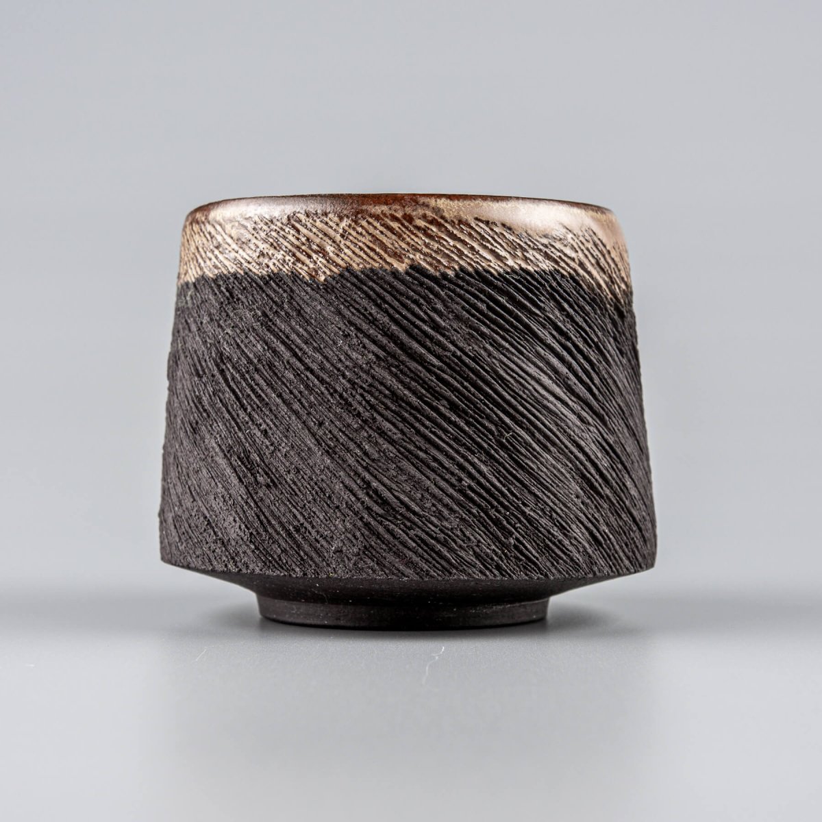Elegant handcrafted pottery mug interior with semi-gloss glaze, perfect for restaurants and home kitchenware.