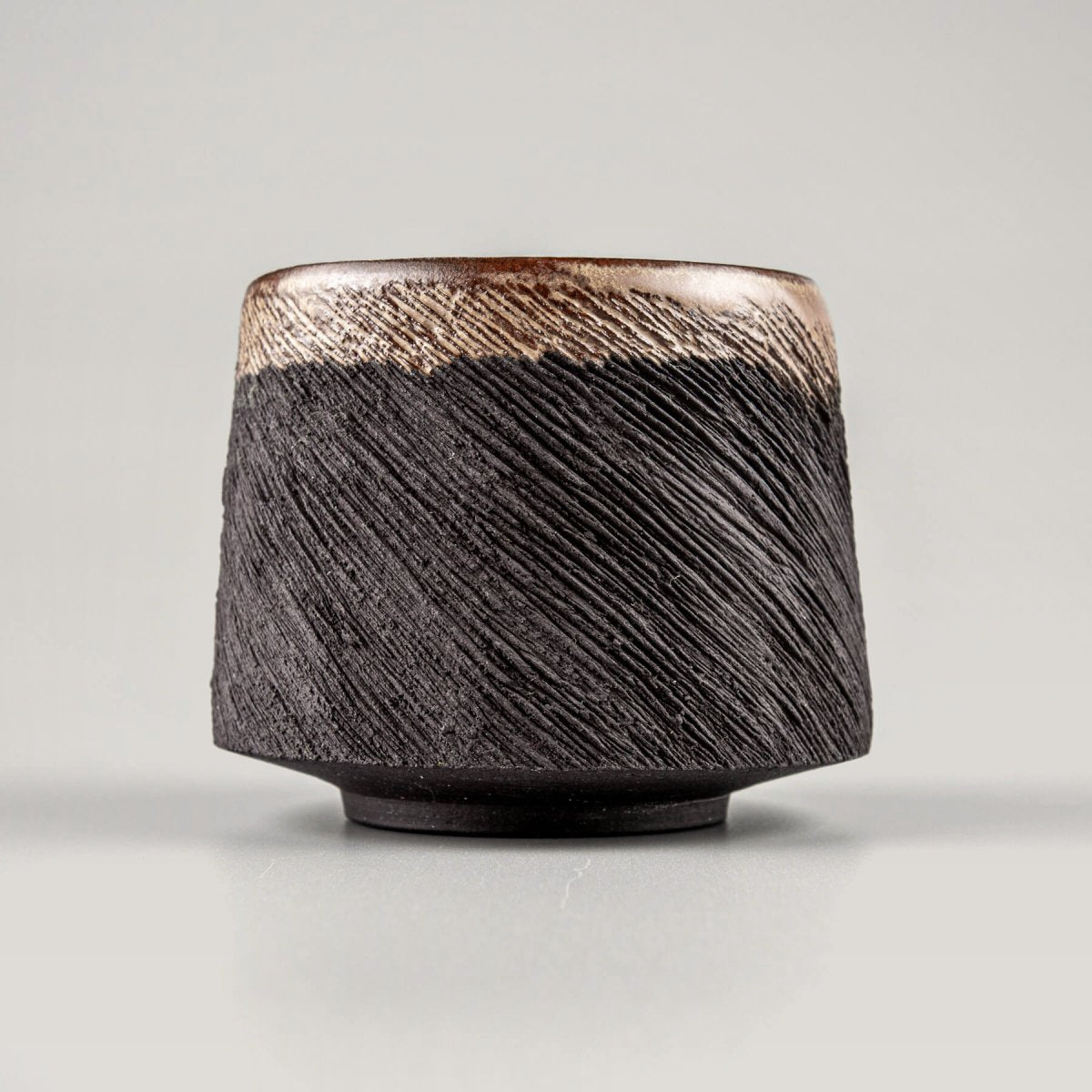 Elegant handcrafted pottery mug interior with semi-gloss glaze, perfect for restaurants and home kitchenware.