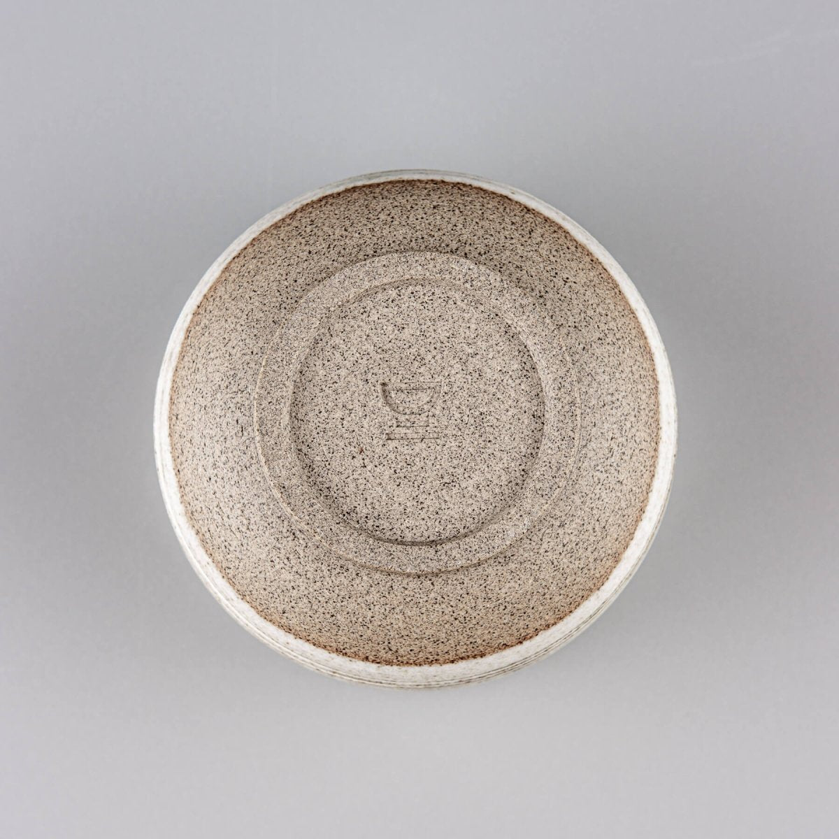Top view of pottery mug showing natural clay texture and handmade craftsmanship.