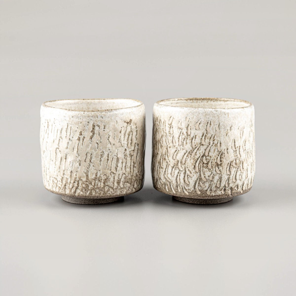 Rustic ceramic espresso cups, handmade with a textured design for home, fine dining, and boutique hotels.