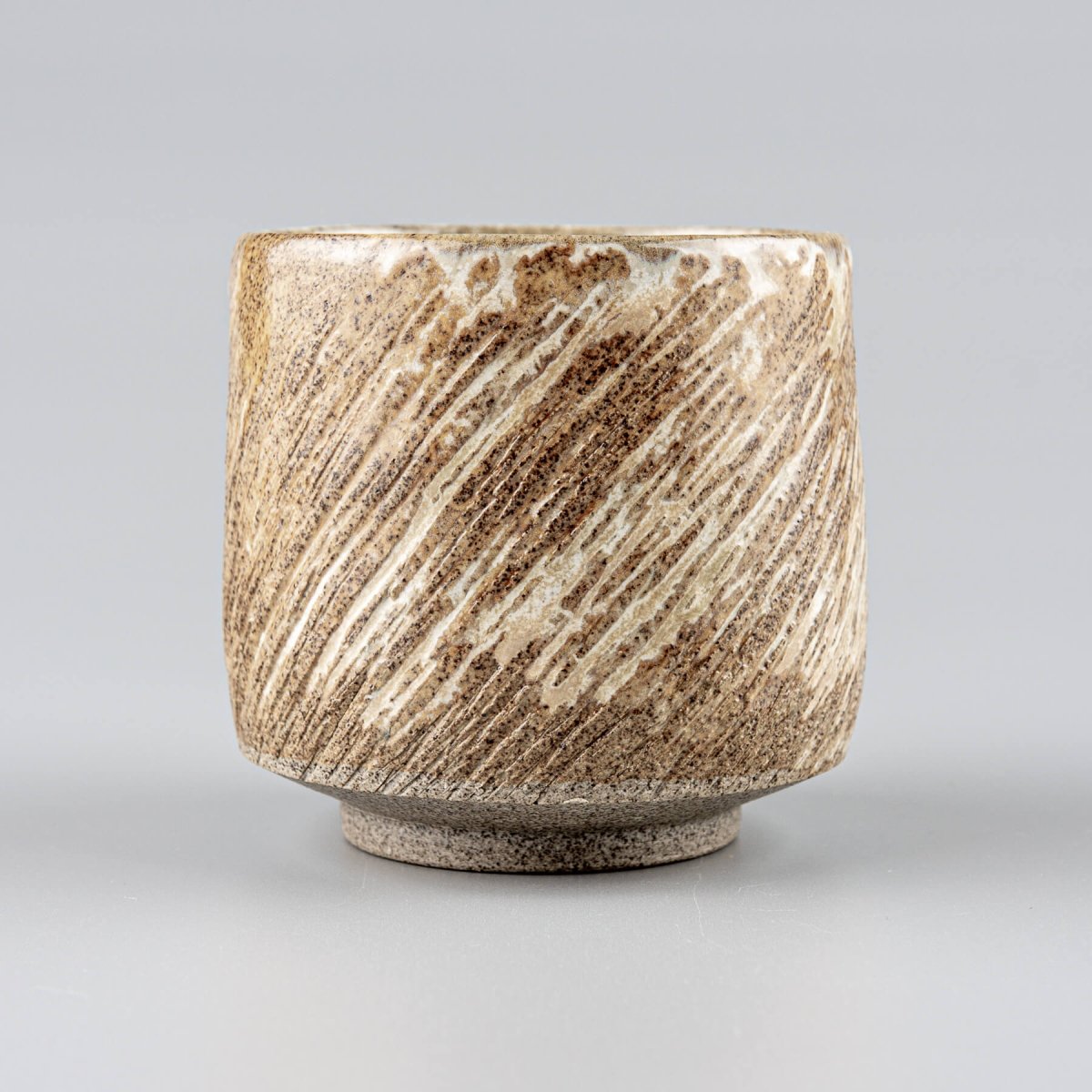 Unique handmade ceramic mugs with textured design, collectible pottery for kitchenware and decor.