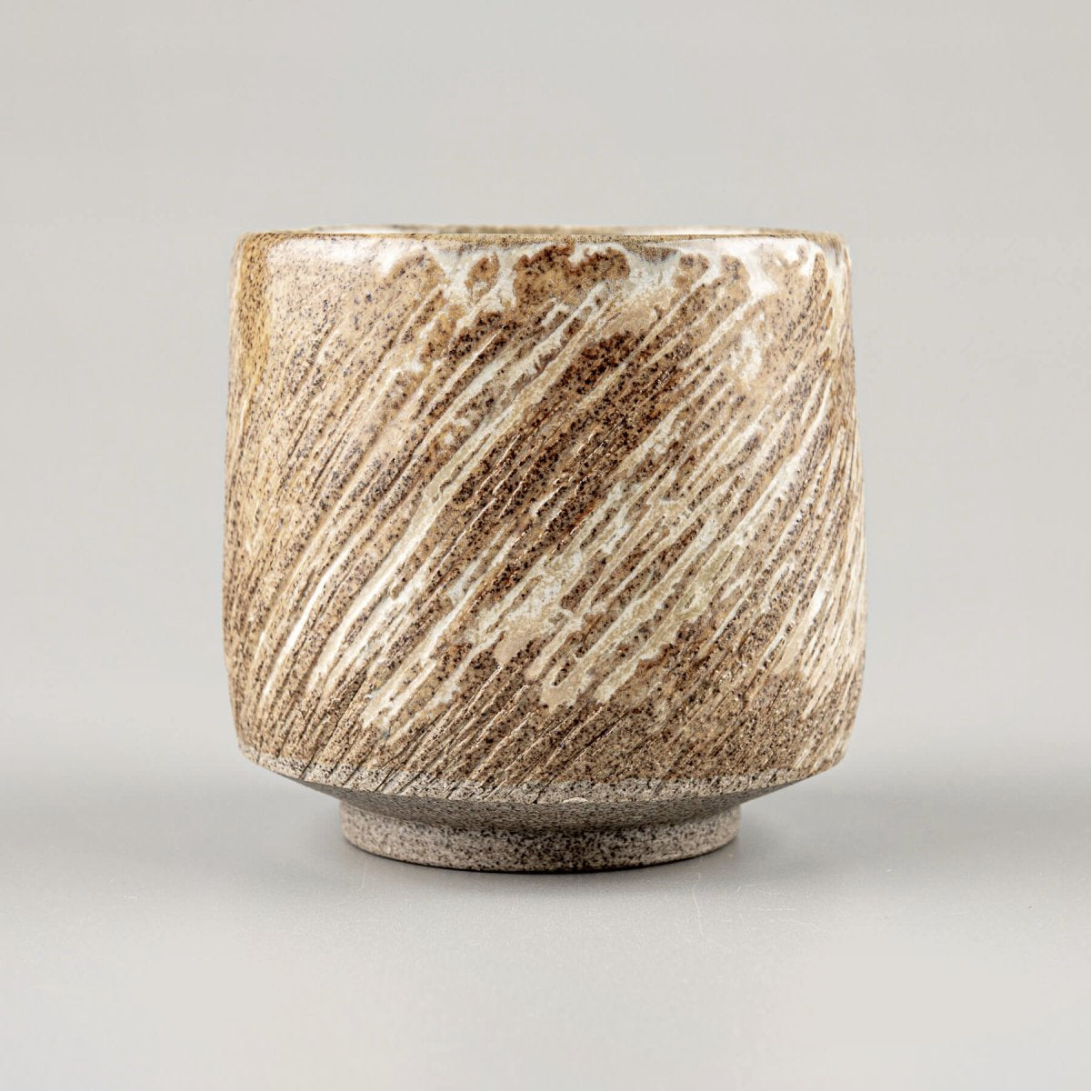 Unique handmade ceramic mugs with textured design, collectible pottery for kitchenware and decor.