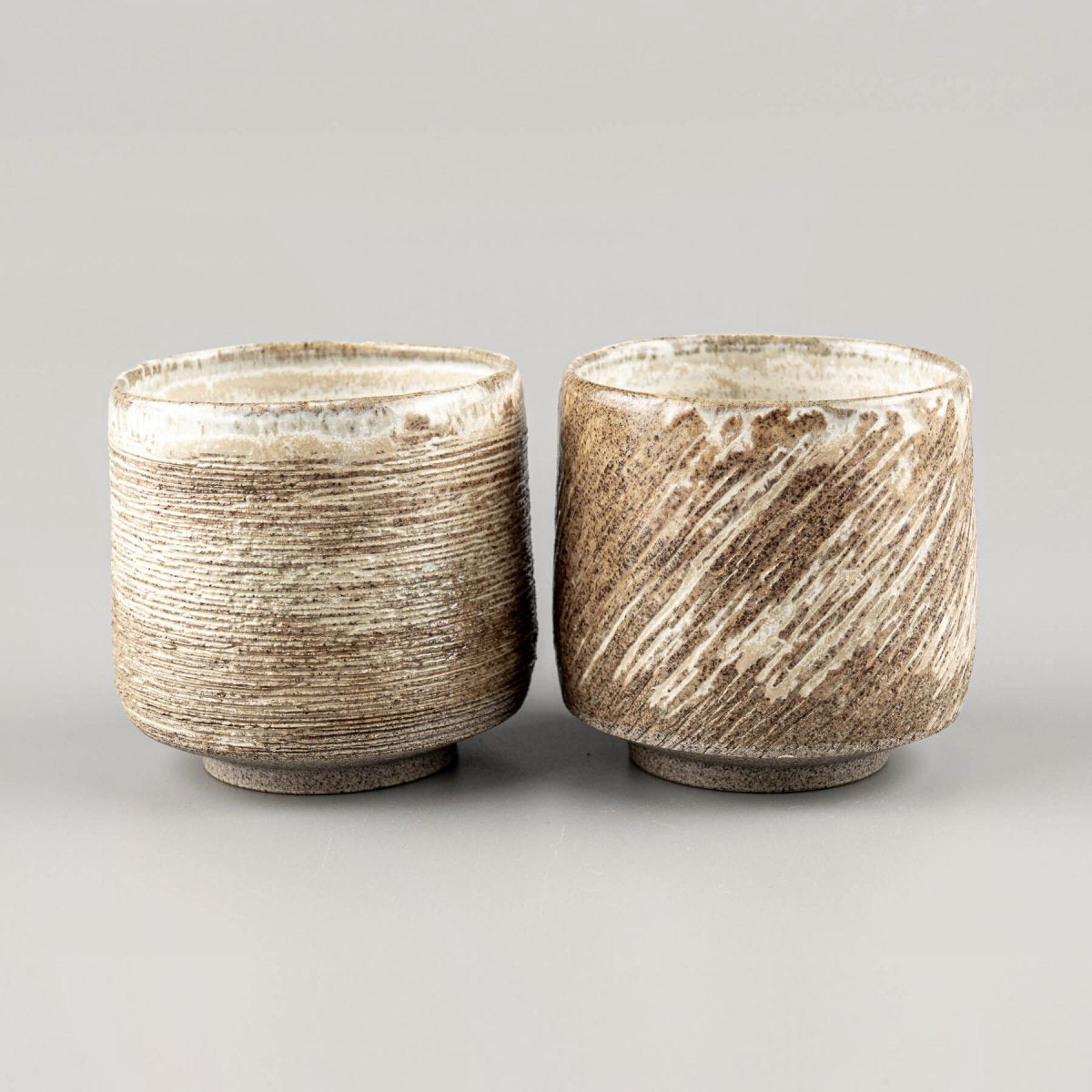 Handmade ceramic mugs set with earthy matte finish, ideal for fine dining and boutique hotels.