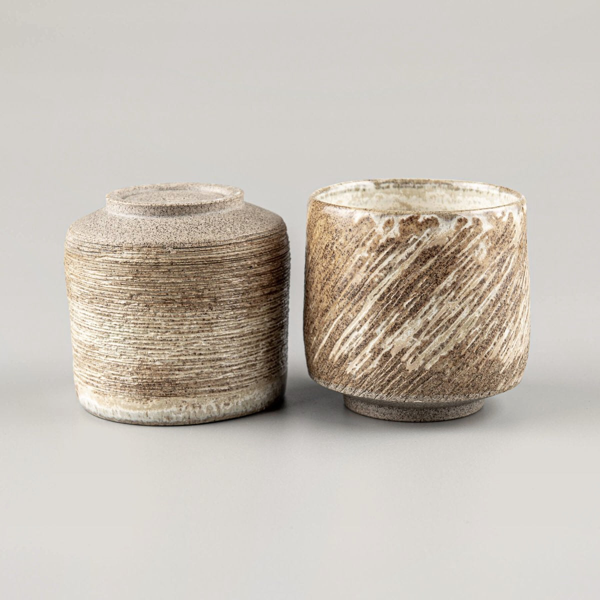Artisan ceramic mugs with earthy texture, handmade décor and kitchenware for interior design lovers.