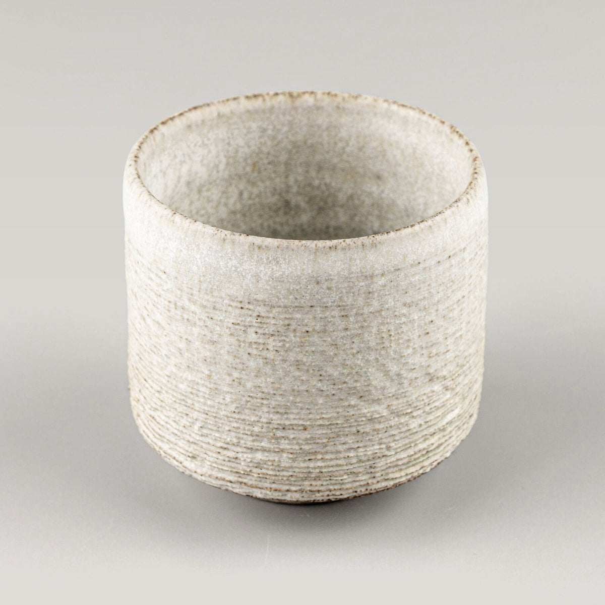 Pair of pottery mugs with textured glaze, perfect as a wedding or housewarming gift.