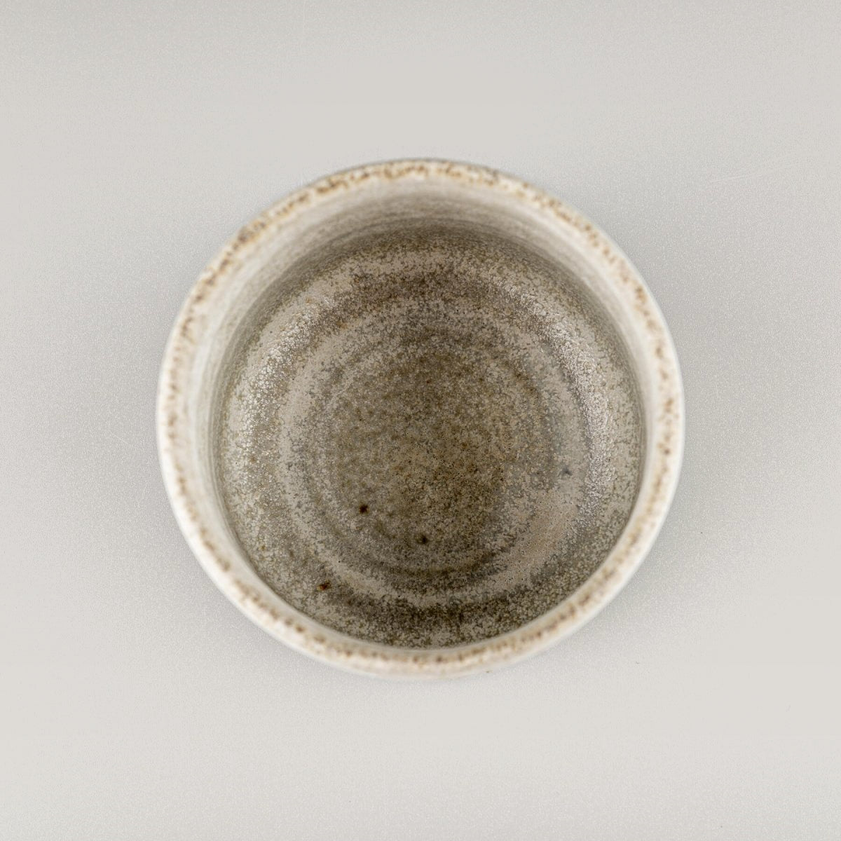 Close-up of handmade ceramic surface, showcasing collectible pottery craftsmanship.