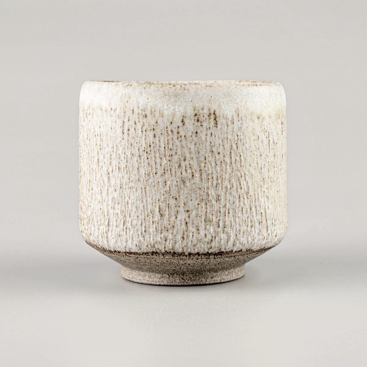 Top view of artisan ceramic mugs for tea, coffee, and matcha tea rituals.