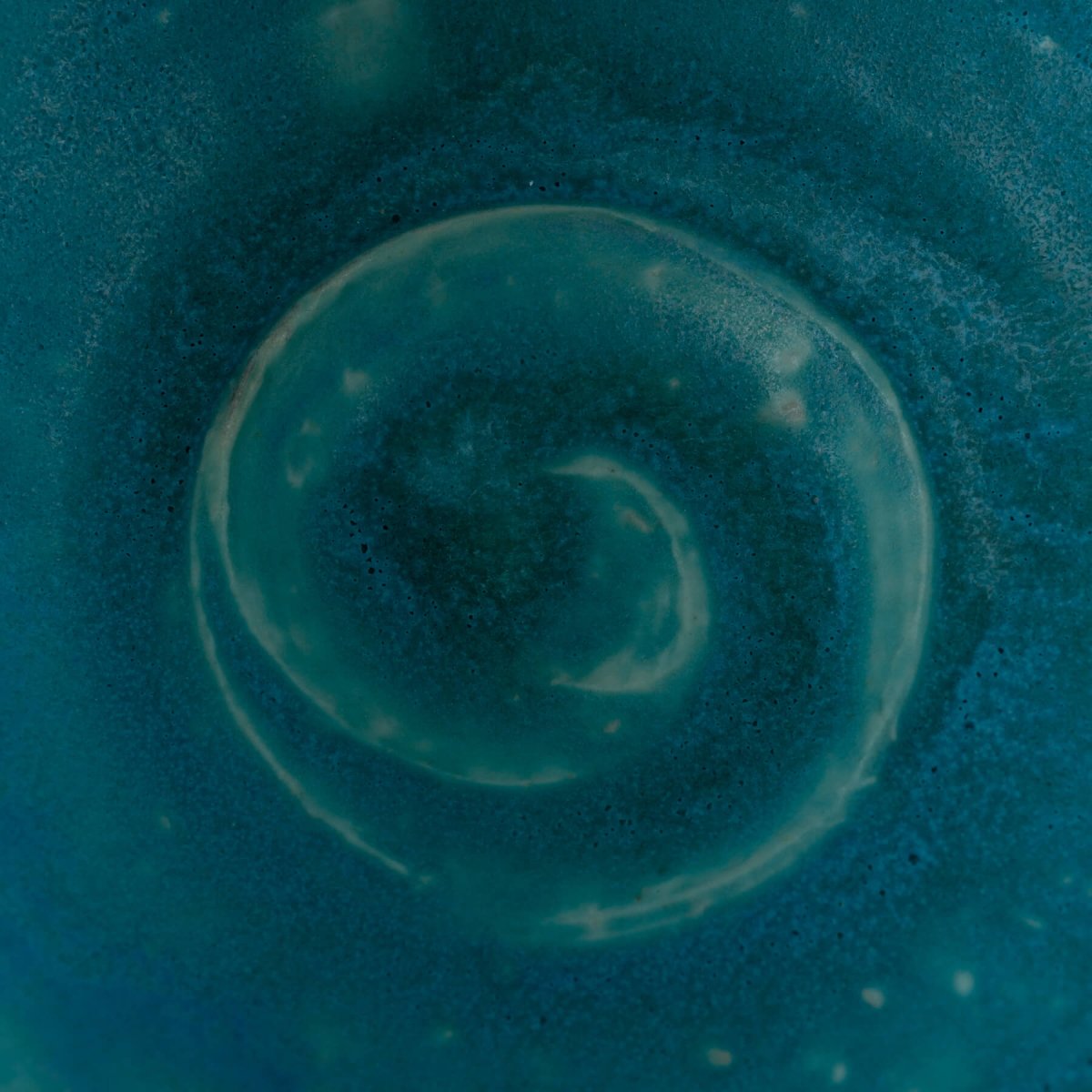 Unique, handmade decor vase with a raw, organic form and vibrant turquoise glaze, perfect for a housewarming gift.