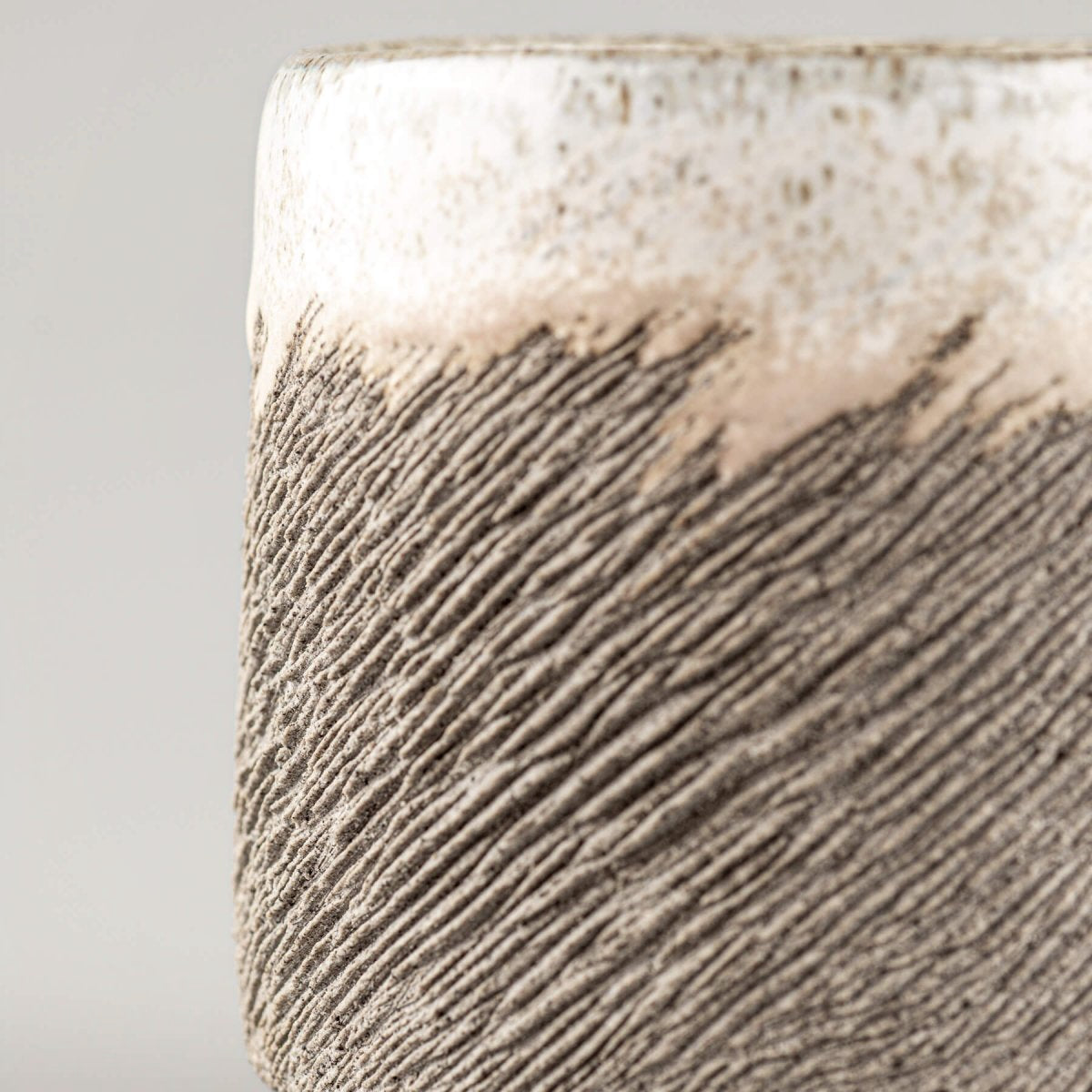 Handmade pottery coffee cup with rustic carved lines and white glaze, ideal for a housewarming gift or a wedding gift idea.