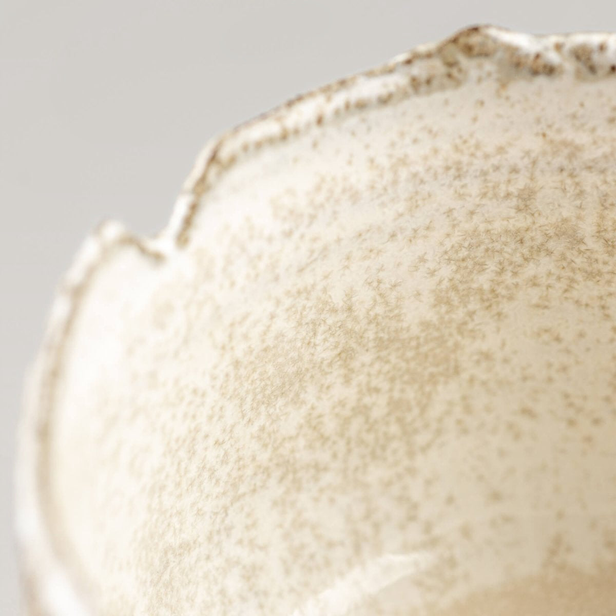 Interior glaze detail of handcrafted stoneware coffee cup, perfect for fine dining presentation.