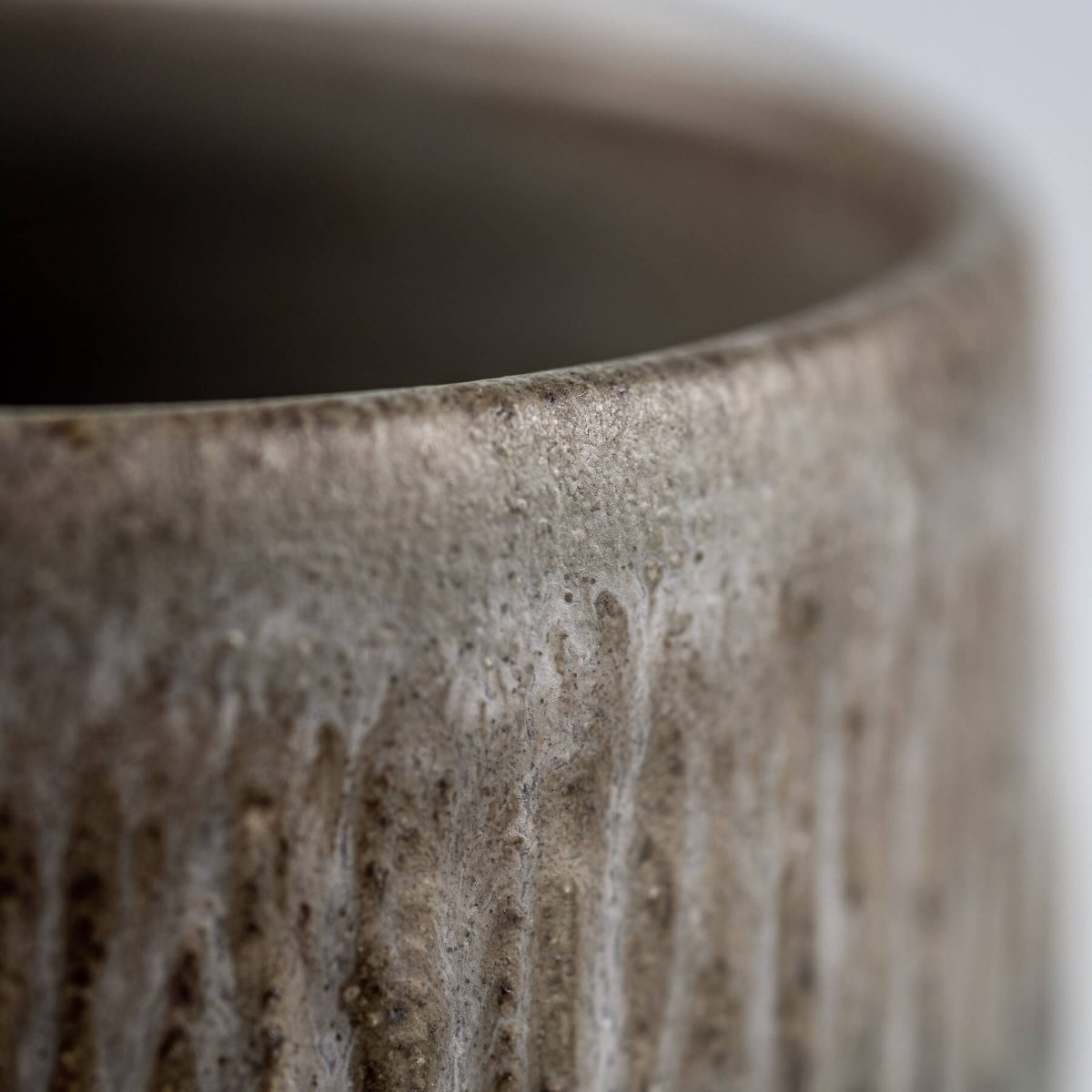 Modern rustic stoneware coffee cups with matte glaze, collectible pottery for home or hospitality settings.