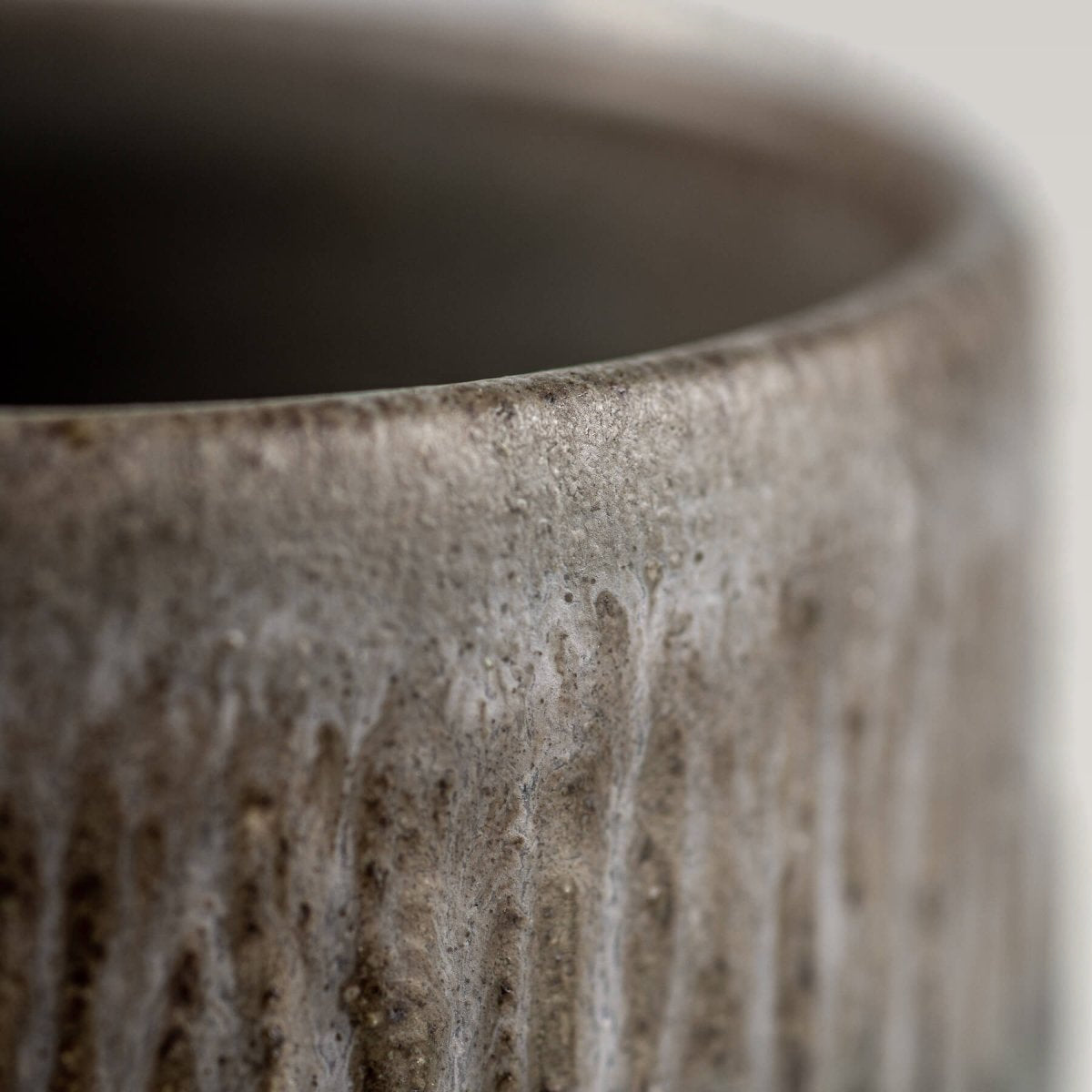 Modern rustic stoneware coffee cups with matte glaze, collectible pottery for home or hospitality settings.