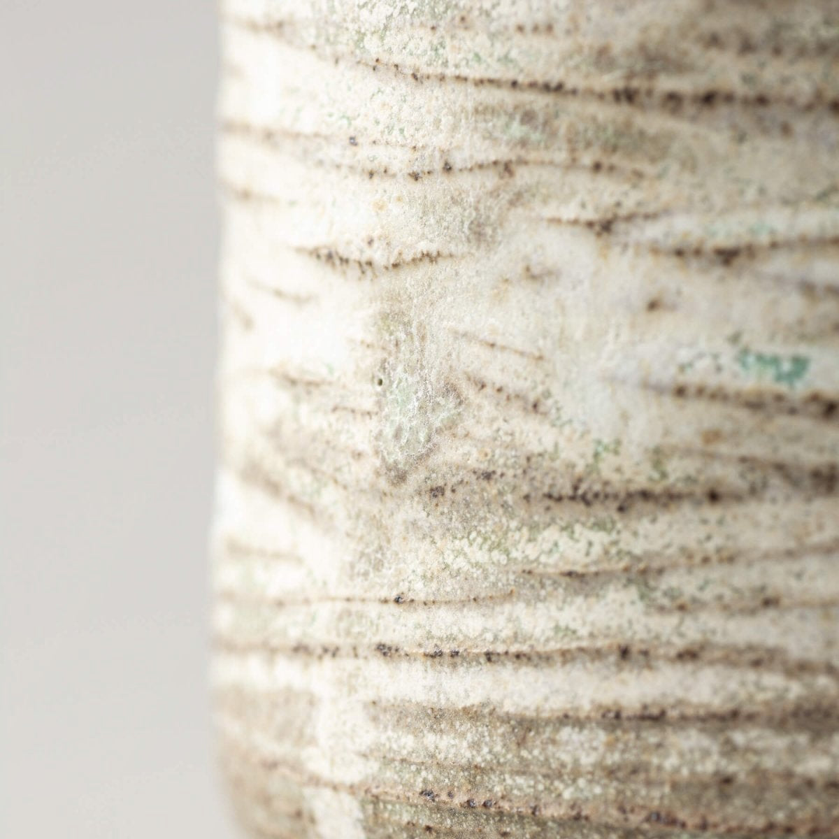 Handmade ceramic mug with textured stoneware surface and rustic glaze, perfect for home, fine dining, and gifts.