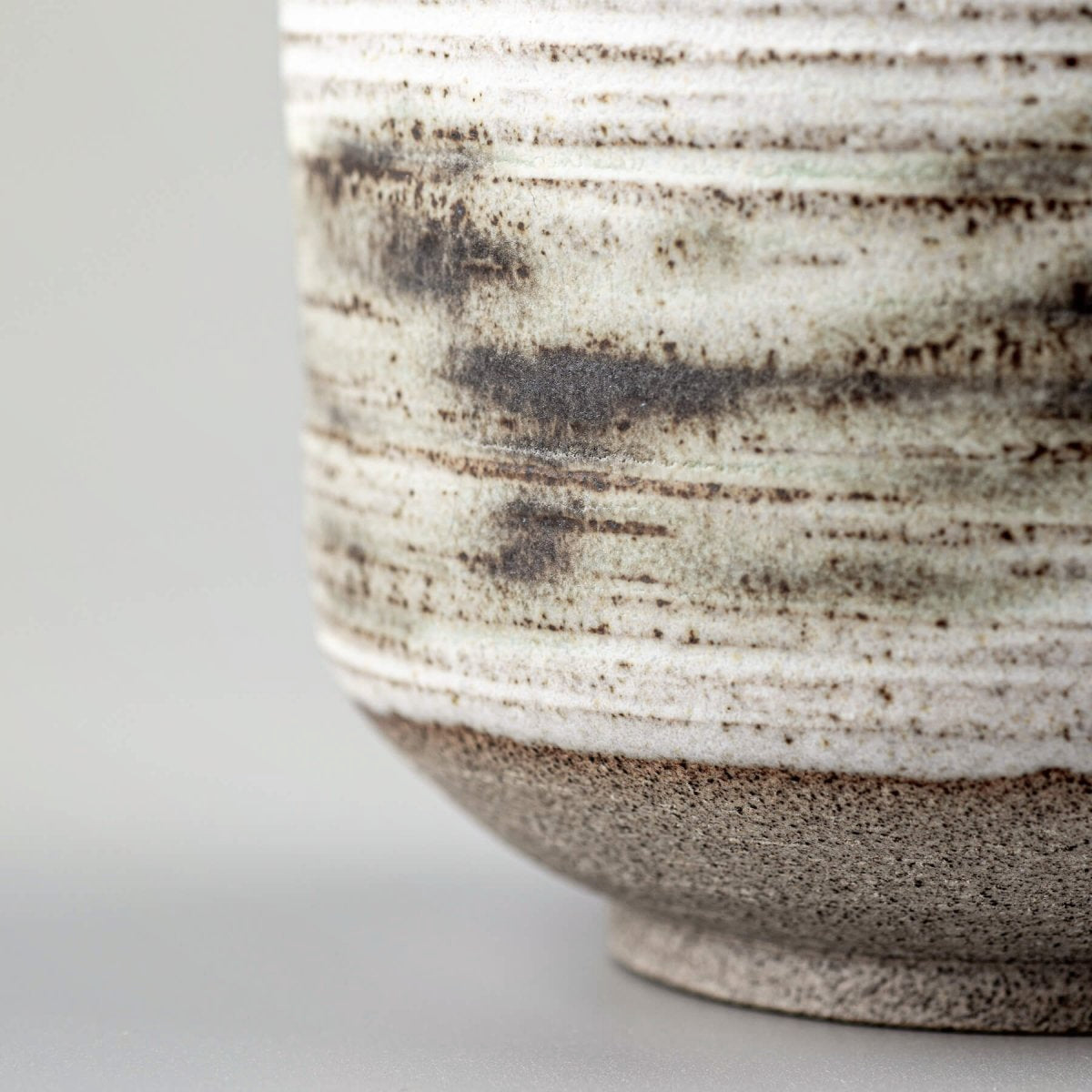 Handmade mugs with natural stoneware base, perfect for restaurants and collectors.