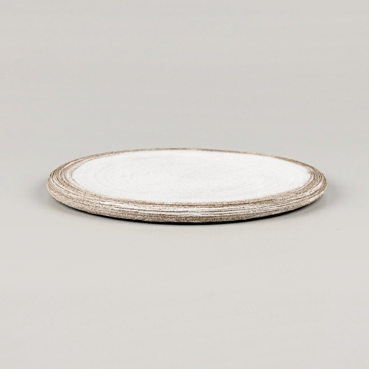 Stacked handmade ceramic plates with minimalist flat design for premium restaurants.