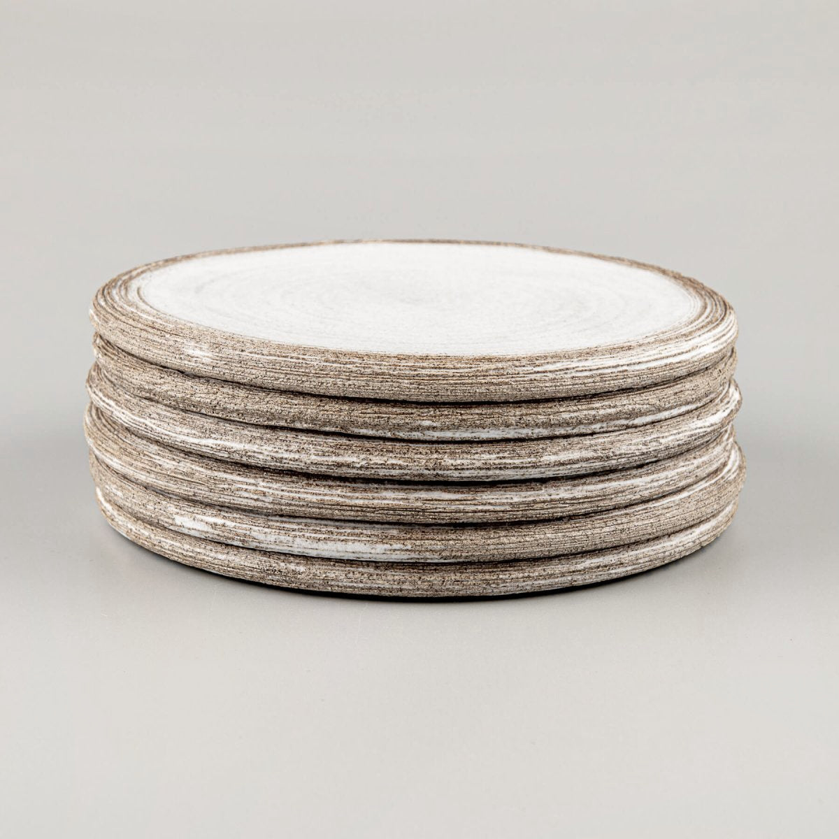 Stacked luxury ceramic plates designed for Michelin-star restaurants and fine dining.