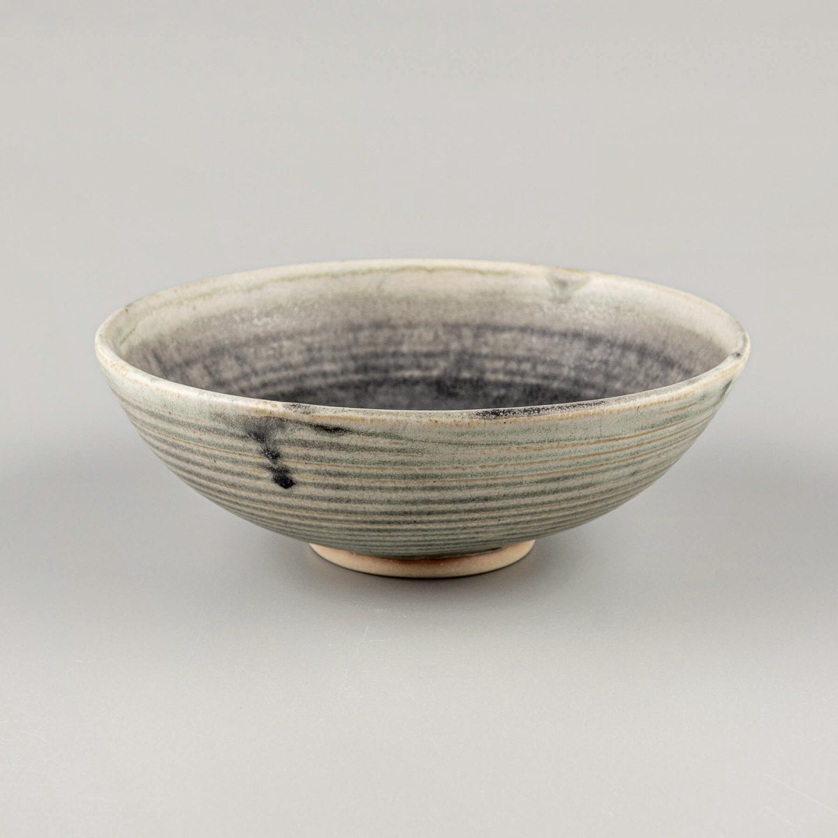 Interior design ceramic bowl with smooth glaze and raw exterior, perfect as handmade decor or wedding gift idea.