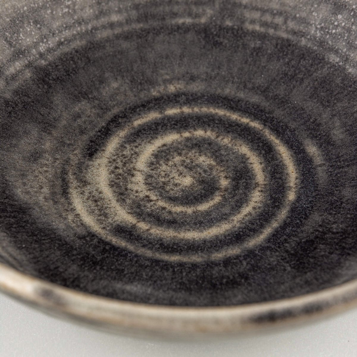 Textured ceramic bowl with matte glaze and natural stoneware feel, suitable for private collectors and interior styling.